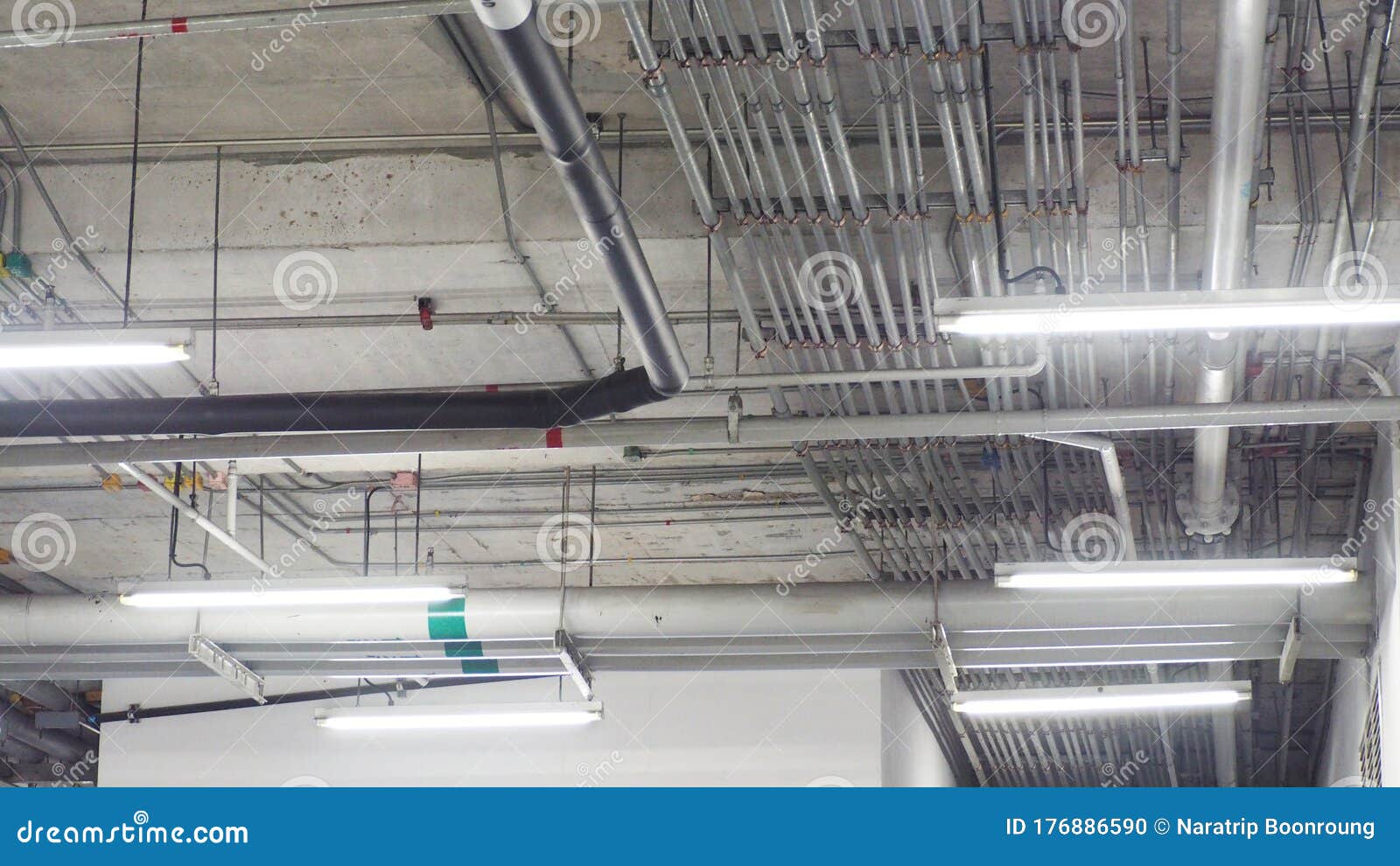 Electrical System Piping in the Building Under Bare Cement Plaster