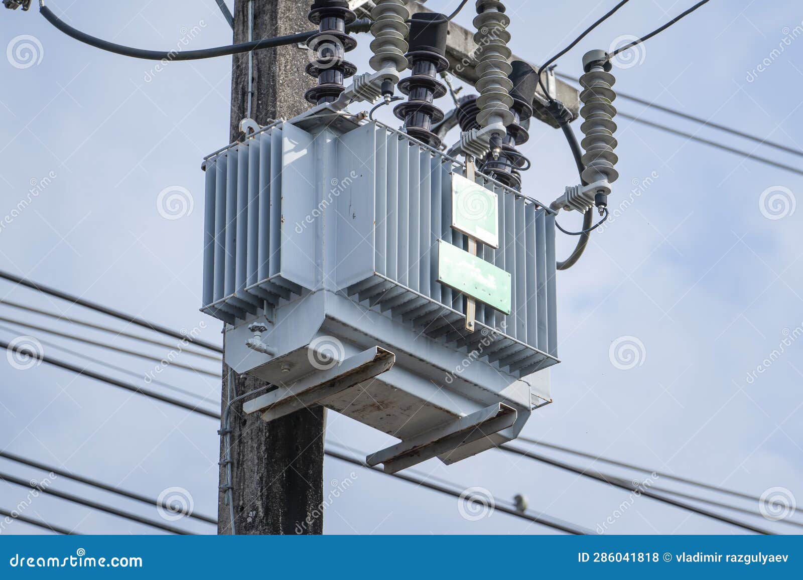 Electrical Transformer on a Power Pole in Thailand, Voltage Stock Photo