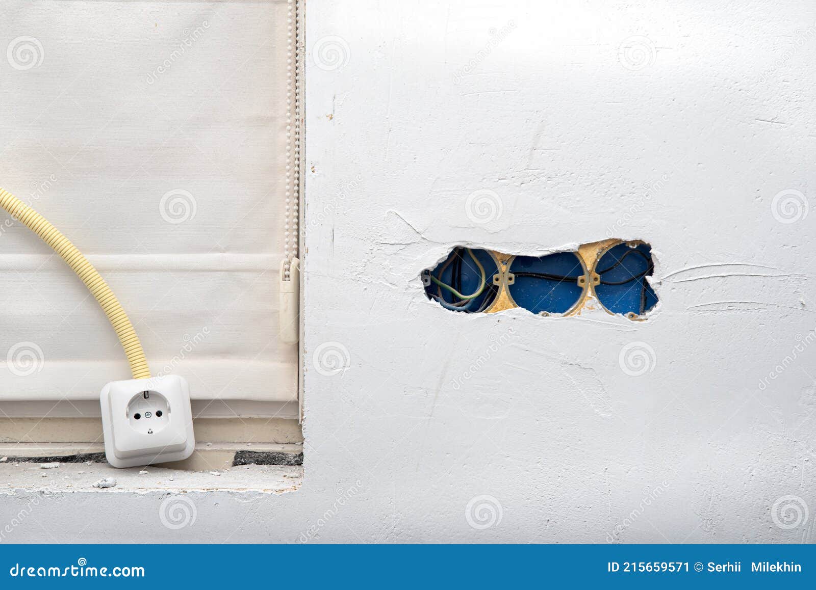 Electrical Wire and Opened Junction Box on Plastering Wall. Home