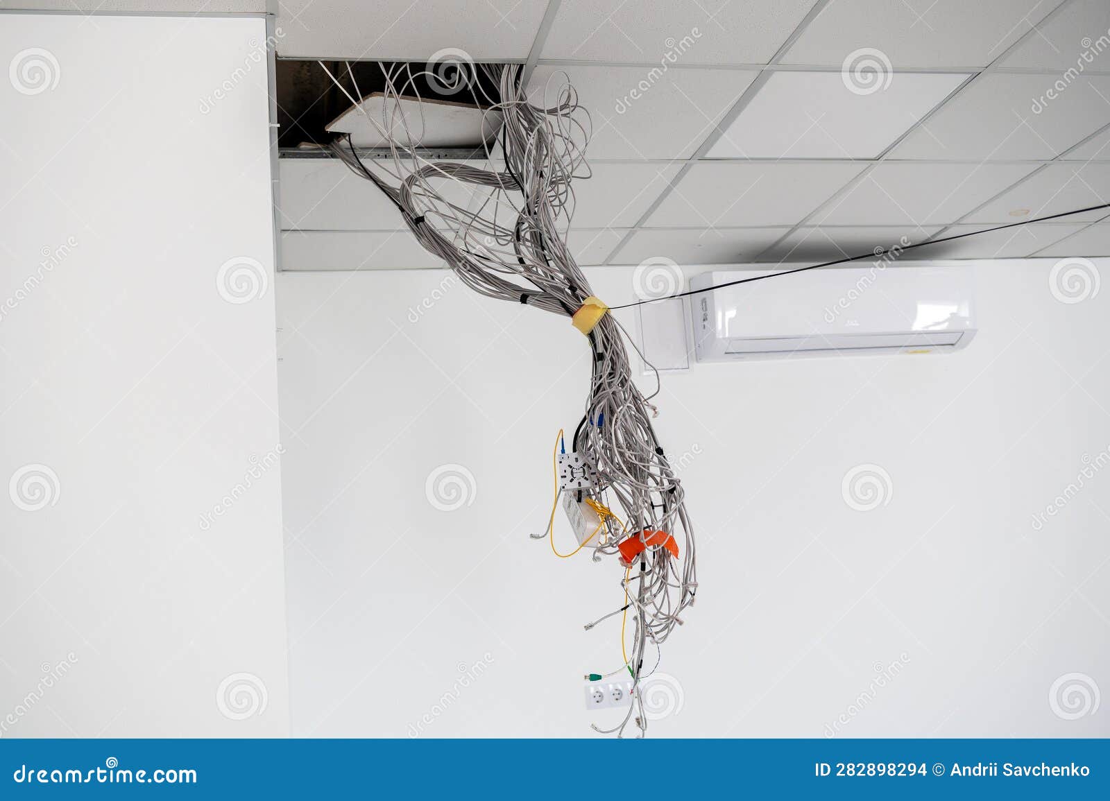 Electrical Wires Hanging from the Ceiling. Cables Hanging from Ceiling