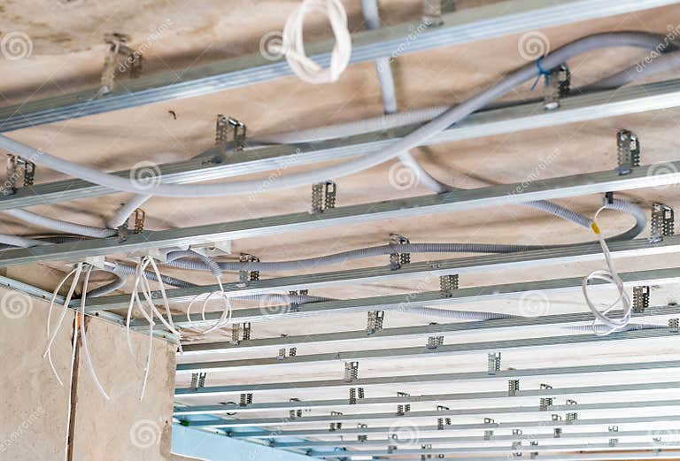 Electrical Wiring on the Concrete Ceiling in Drywall Stock Photo