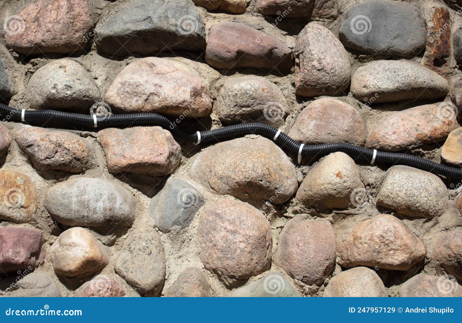 Electrical Wiring on the Wall of Stone Bricks. Stock Image Image of