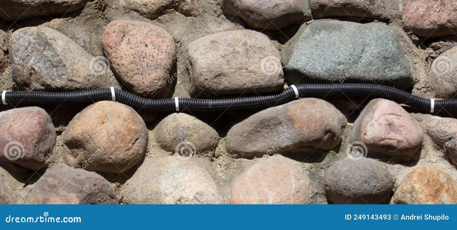 Electrical Wiring on the Wall of Stone Bricks. Stock Image Image of