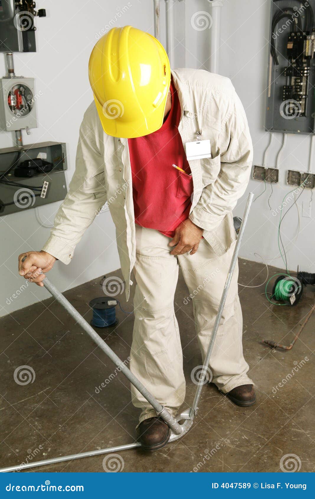 Electrician Bends Pipe stock image. Image of construction 4047589