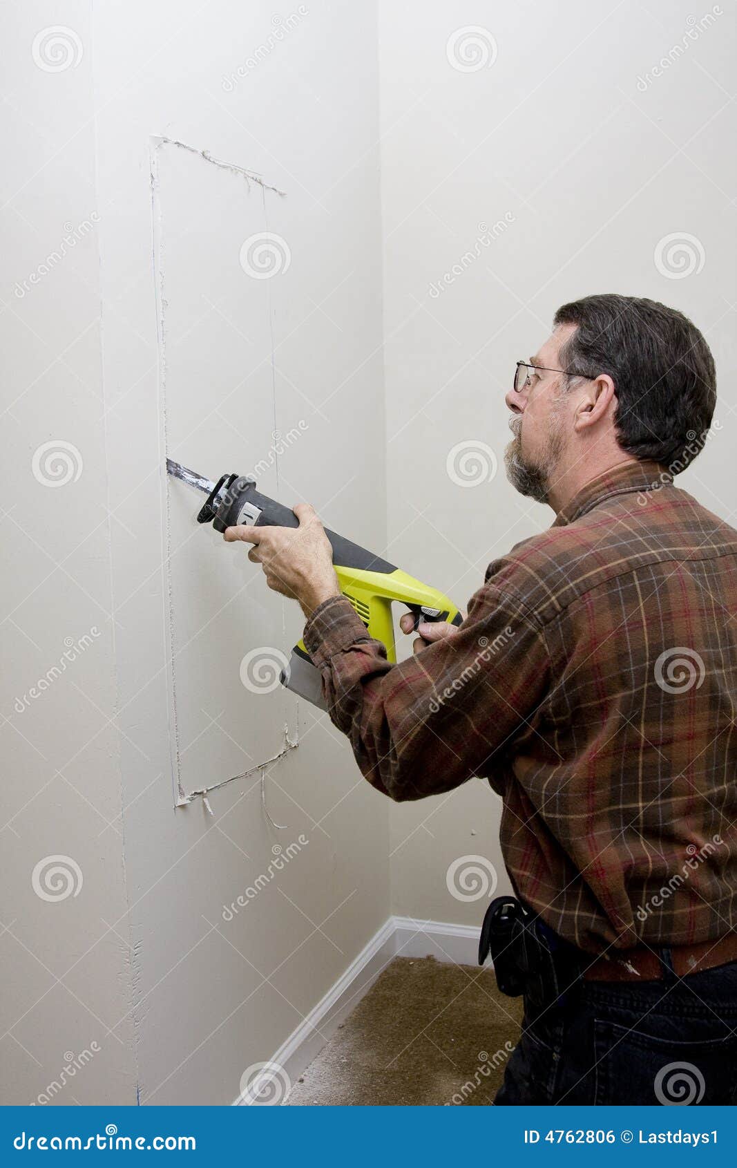 Electrician Cutting Access Hole Stock Photo Image of sheetrock