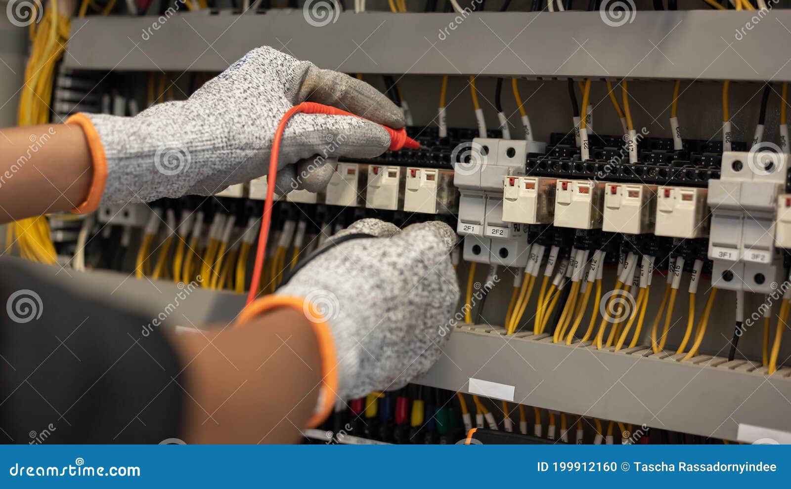 Electrician Engineer Uses a Multimeter To Test the Electrical