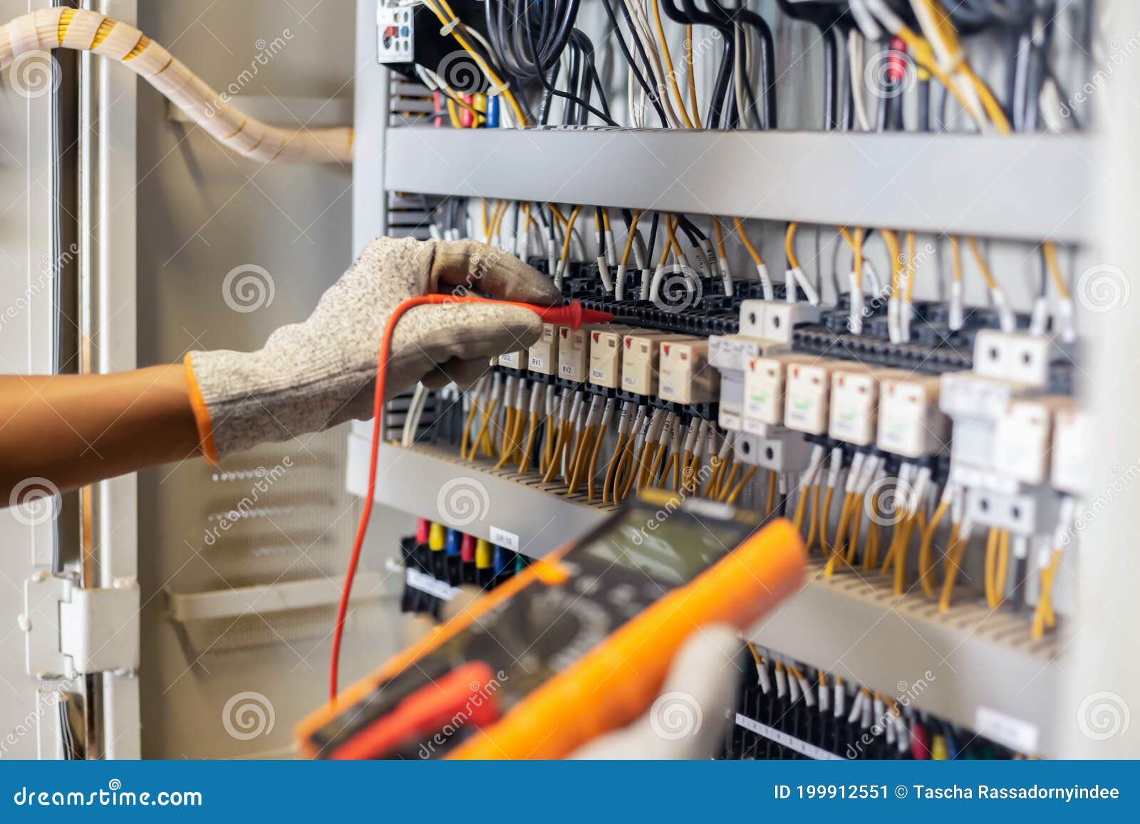 Electrician Engineer Uses a Multimeter To Test the Electrical