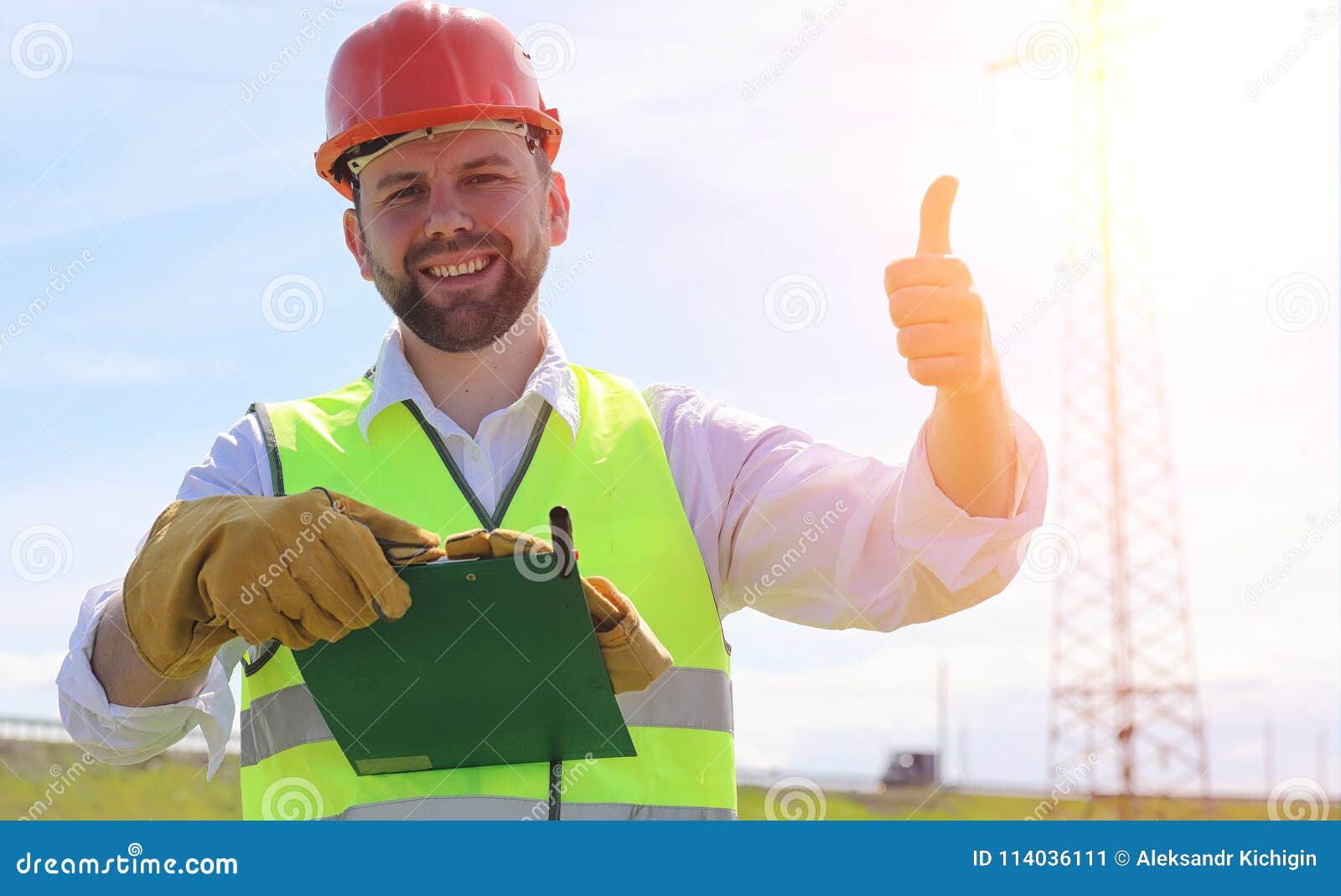 An Electrician In The Fields Near The Power Transmission ... An Electrician In The Fields Near The Power Transmission ...