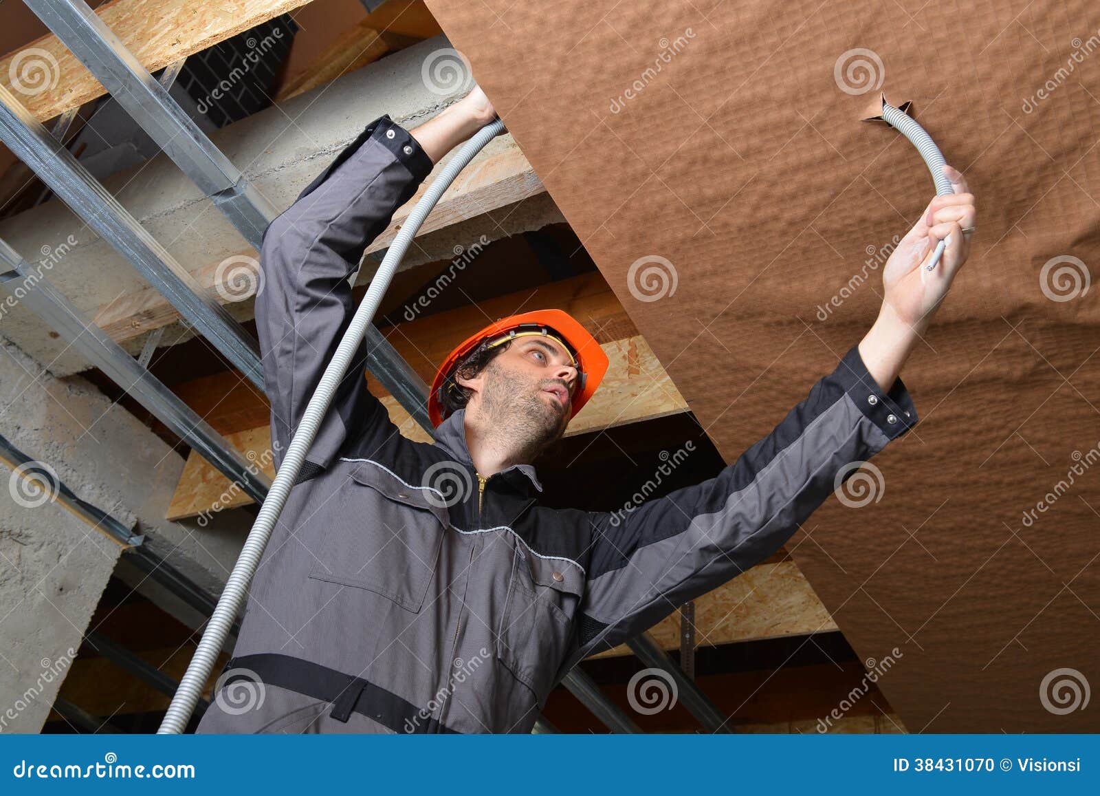 Electrician Fitting a Cable Stock Photo Image of installation