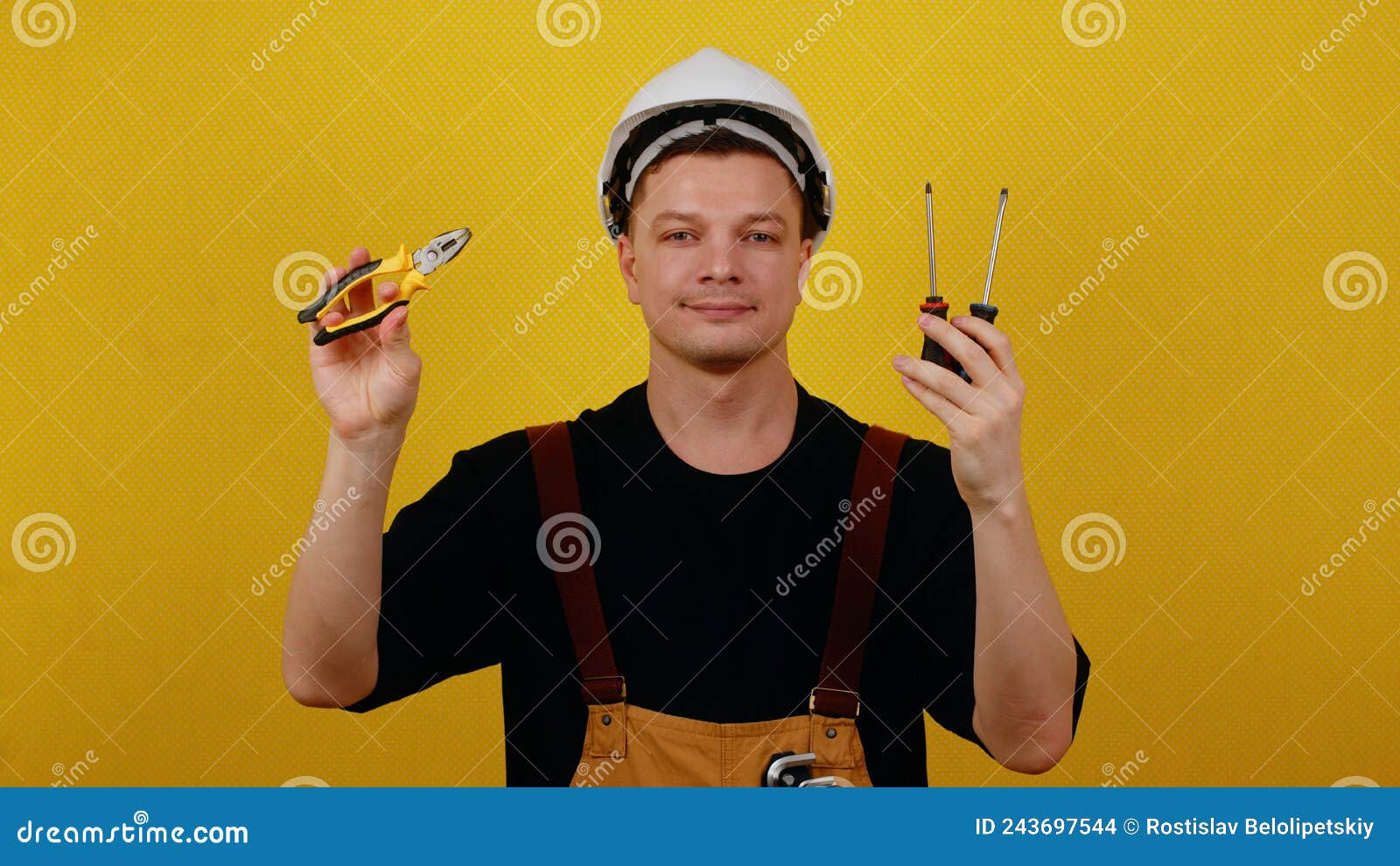 Electrician or Handyman Holds Tools for Working with Electricity in His ...