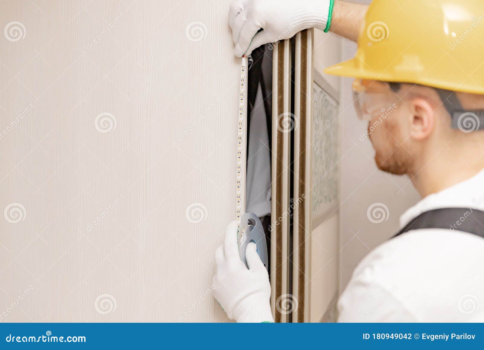 Electrician Installing Mounting Tape LED Strip Light Decorative