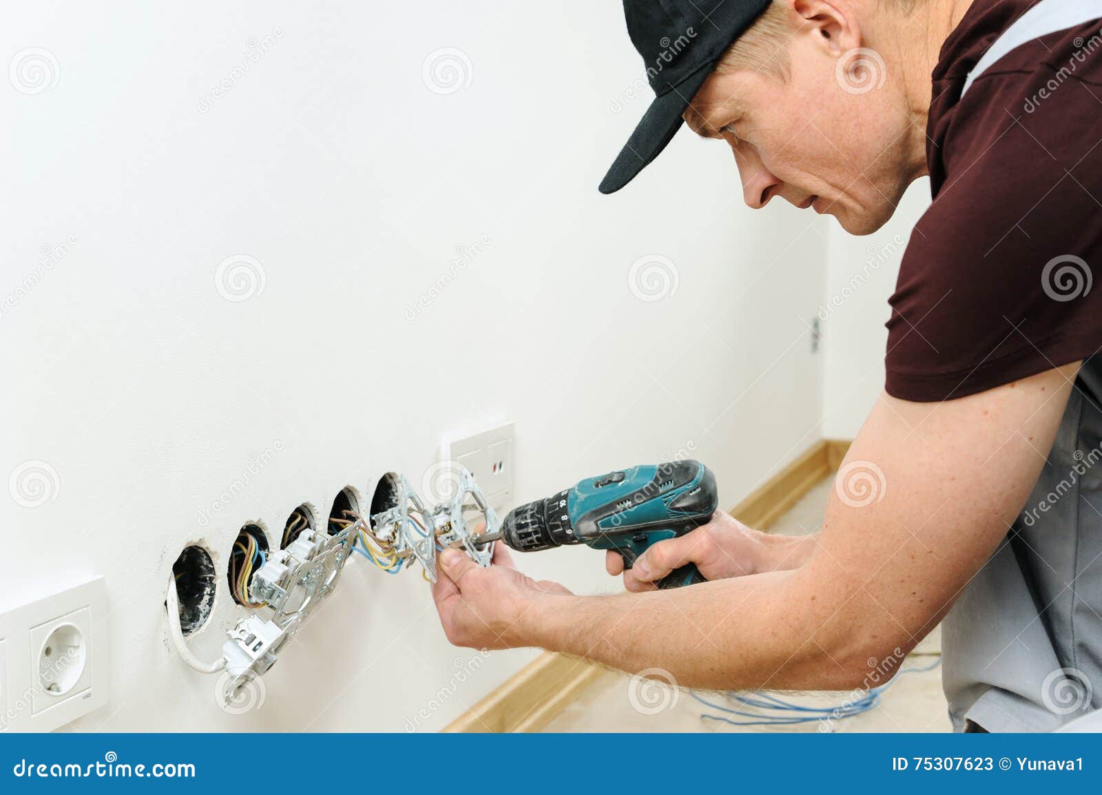 Electrician Installs Electrical Outlets. Stock Image Image of