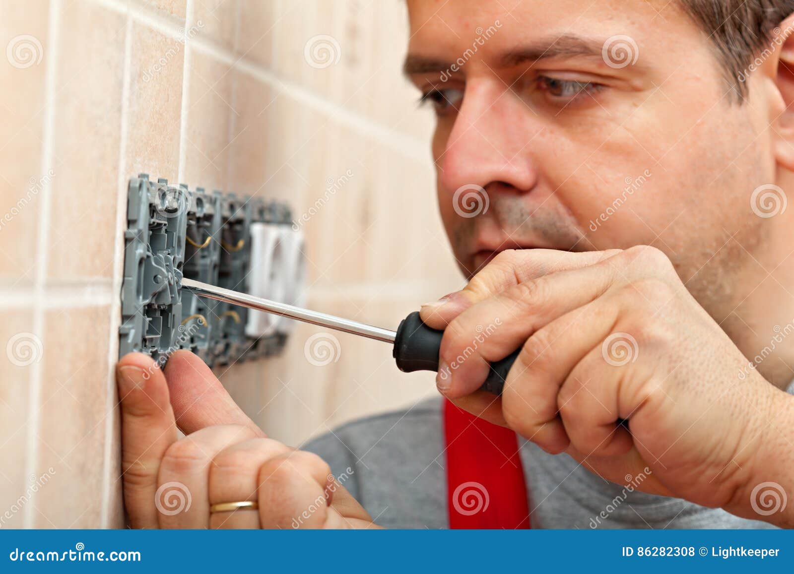 Electrician Mounting Electrical Wall Fixture Stock Photo Image of