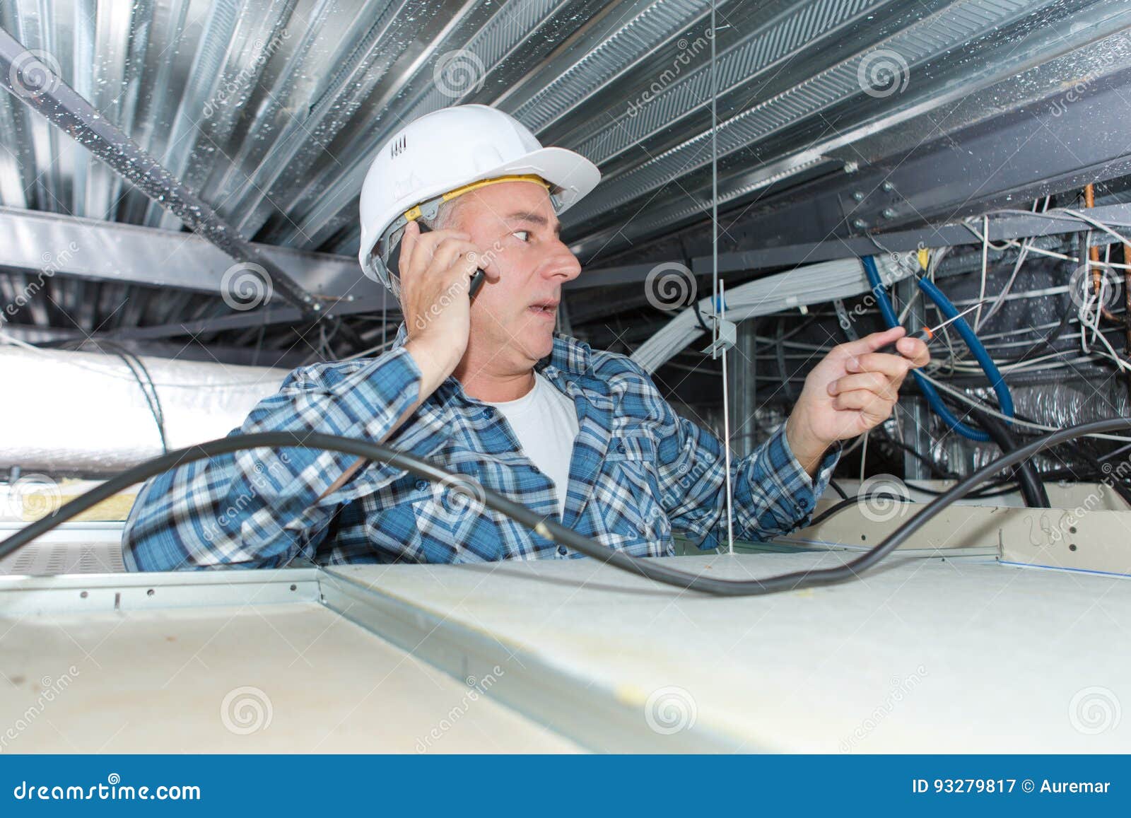 Electrician on Phone with Client Inside Ceiling Stock Image Image of