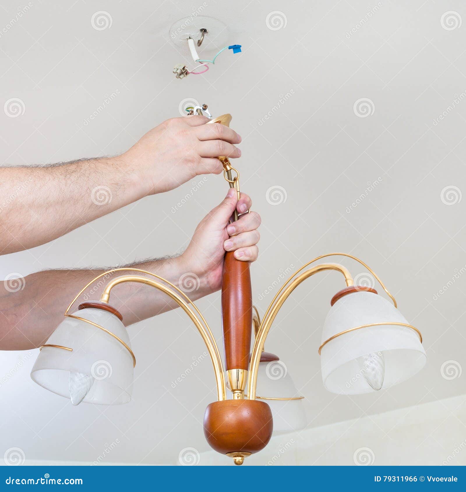 Electrician Removes Decorative Ceiling Light Stock Photo Image of