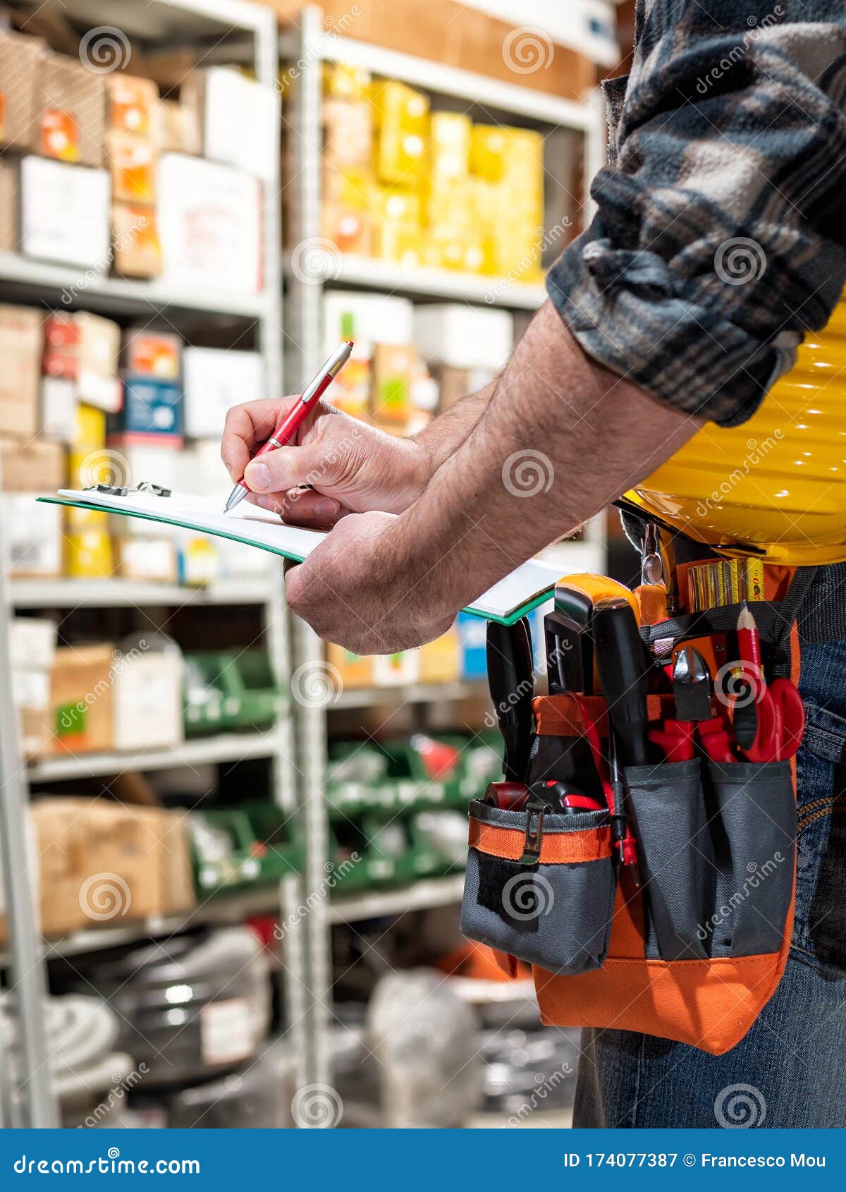 Electrician in the Store of Electrical Components. Electricity Stock