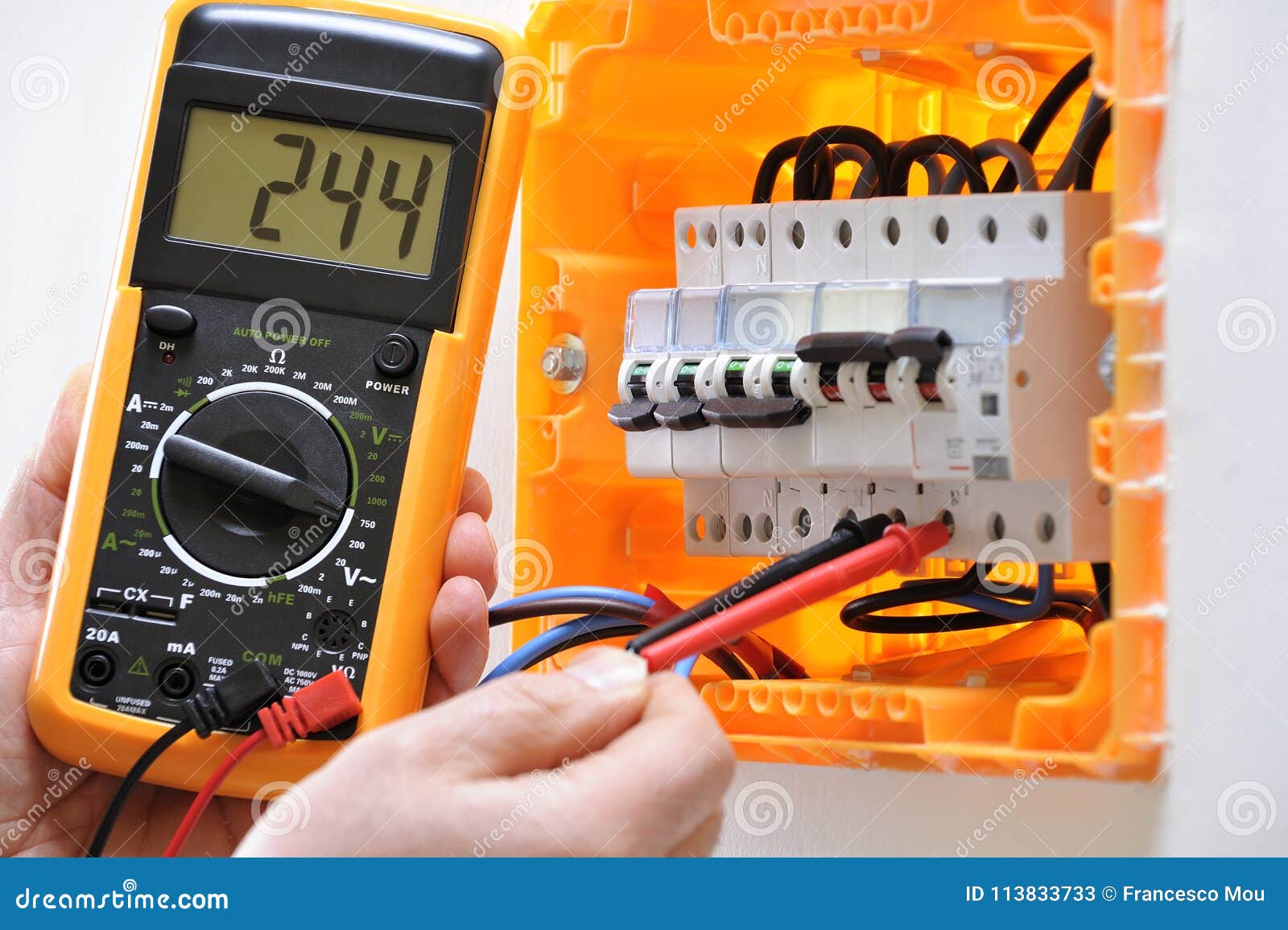Electrician Technician at Work on a Residential Electric Panel Stock