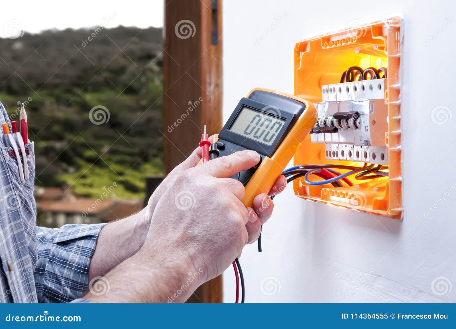 Electrician Technician Repairs the Electrical Panel of a Residential