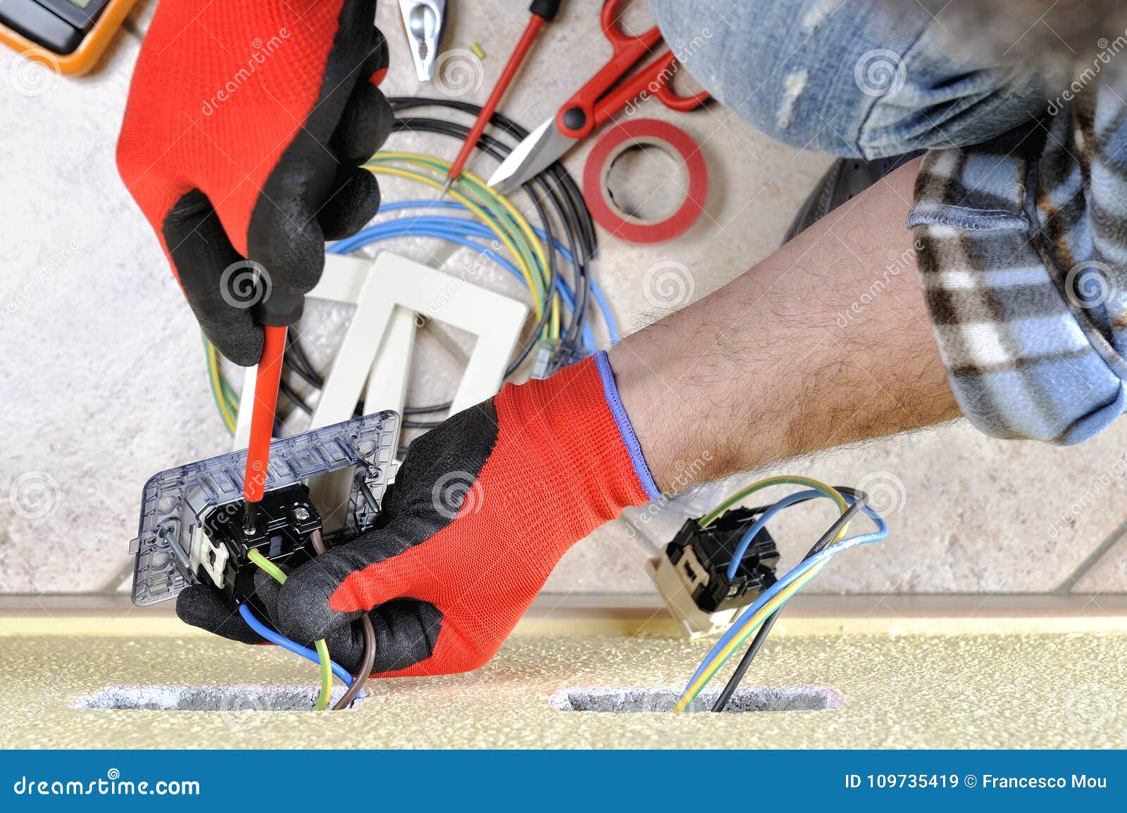 Electrician Technician at Work with Safety Equipment on a Residential