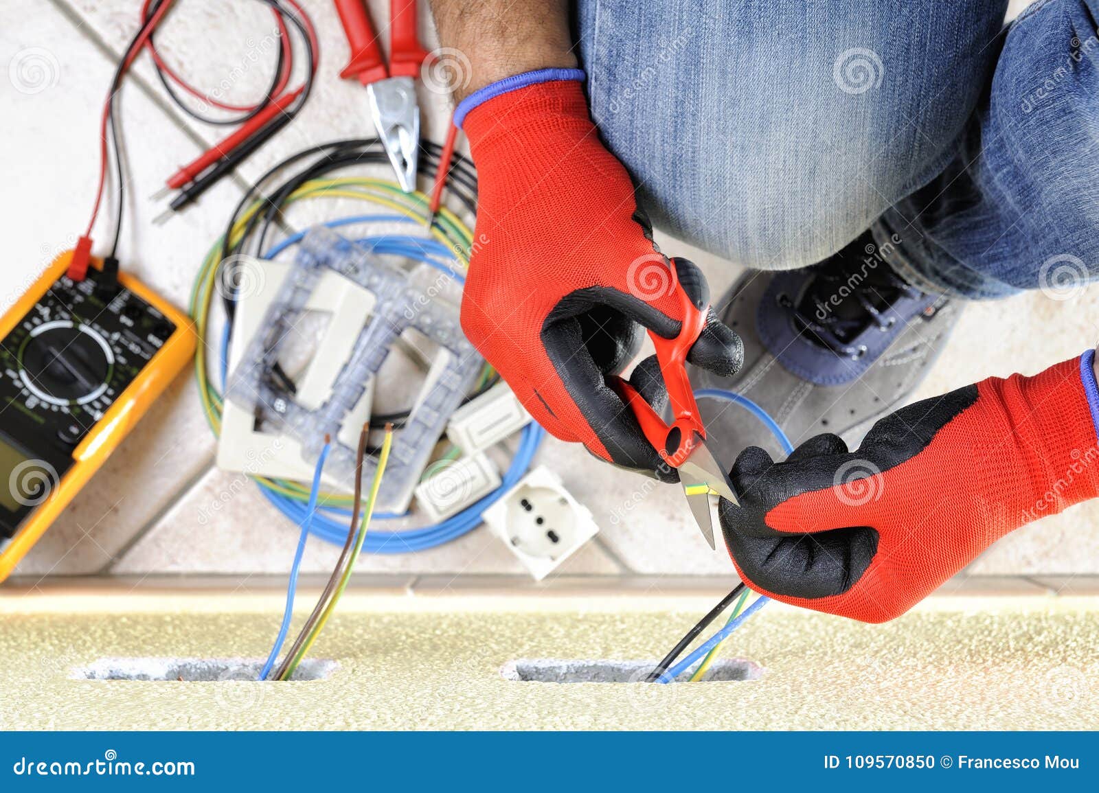 Electrician Technician at Work with Safety Equipment on a Residential