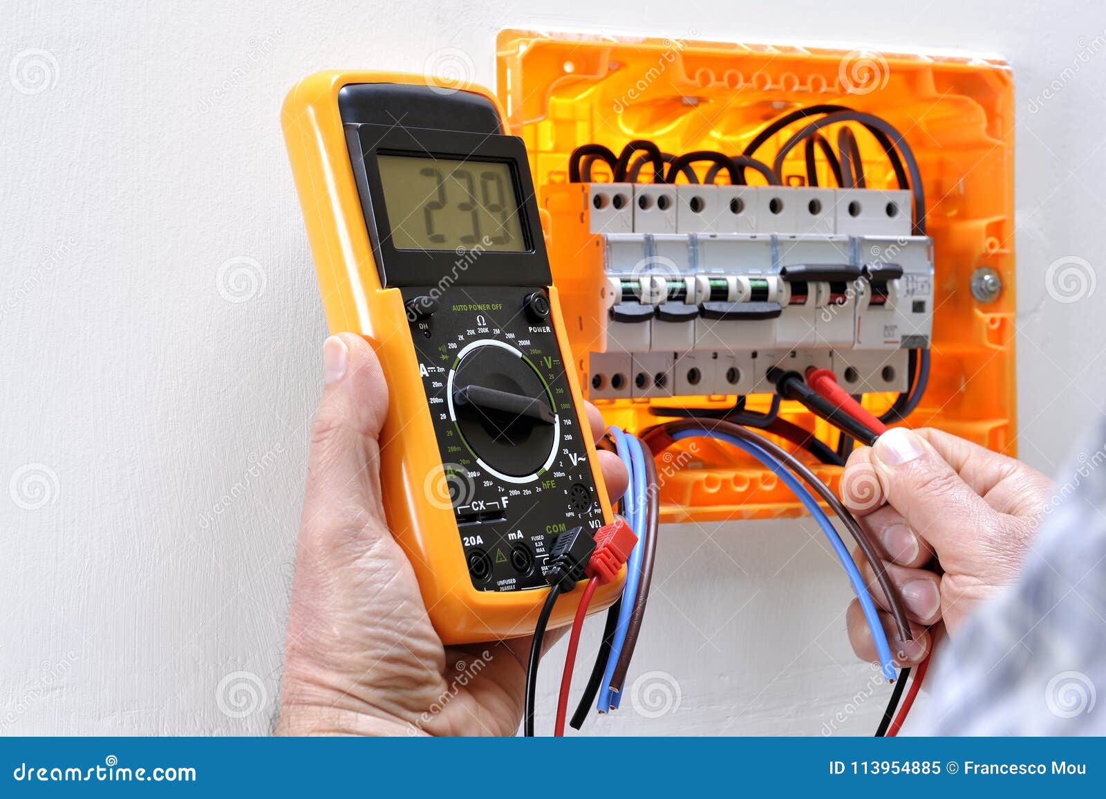 Electrician Technician at Work on a Residential Electric Panel Stock