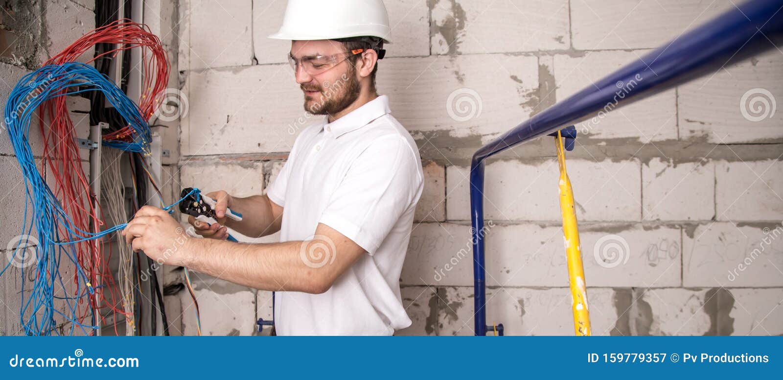 Electrician Working Near The Board With Wires ... Electrician Working Near The Board With Wires ...