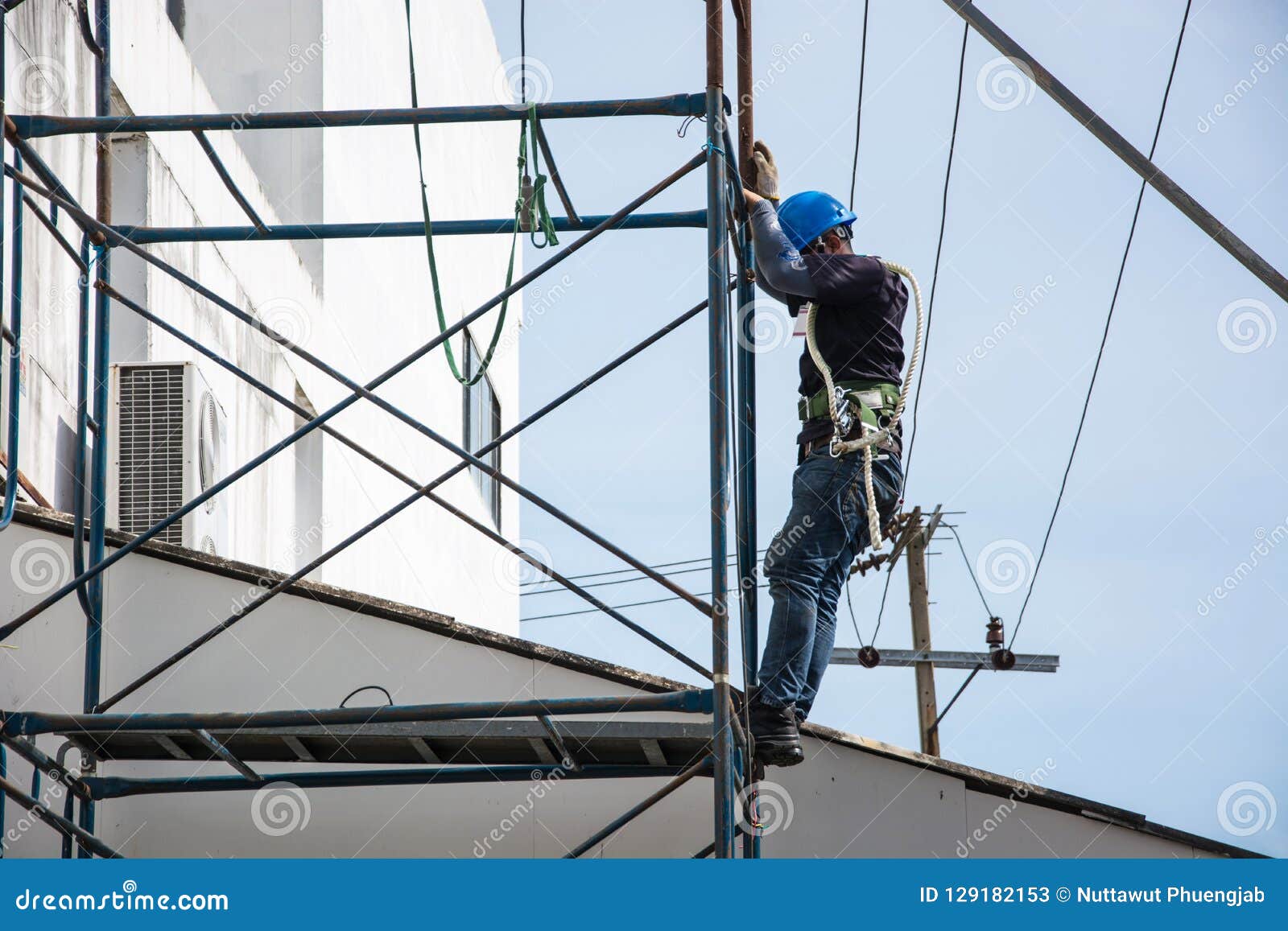 Electrician is Working on Scaffolding Outdoor. Stock Image Image of