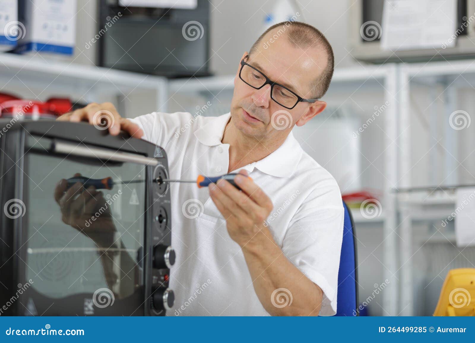 Electrician Working on Tabletop Oven Stock Image Image of inside