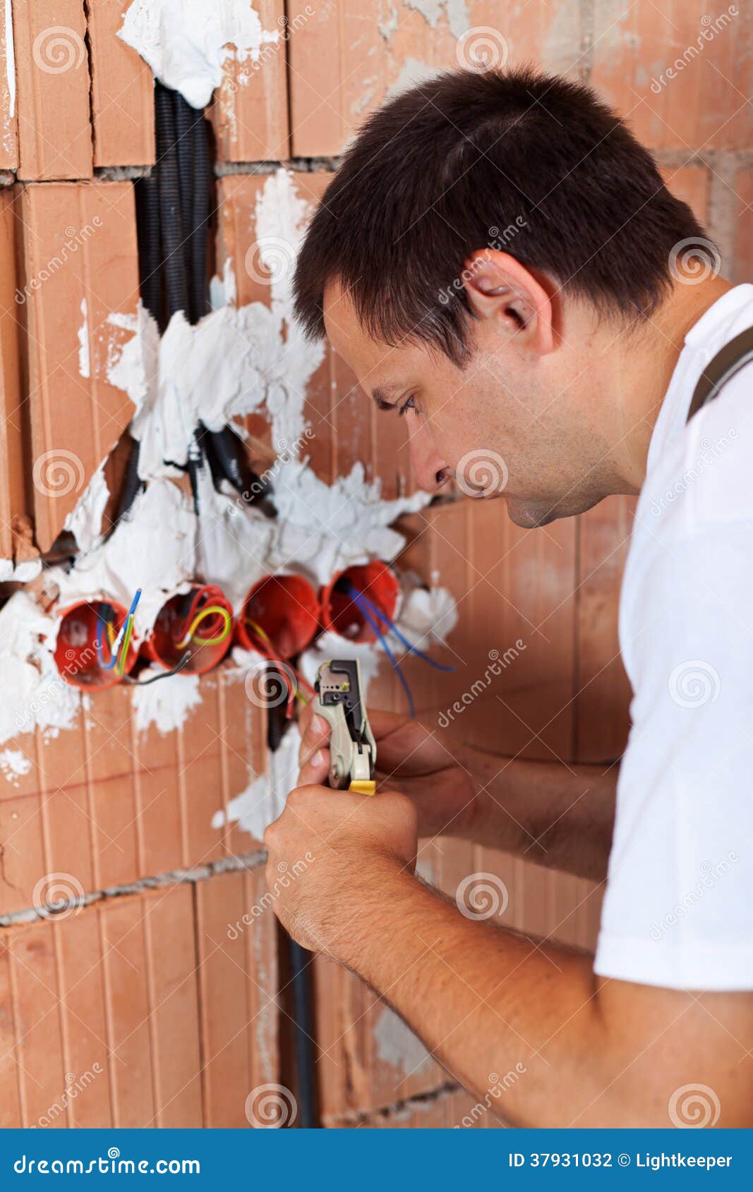 Electrician Working with Wires in a New Building Stock Photo Image of