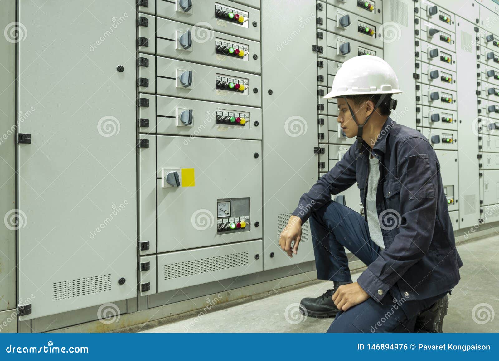 Electricians are Checking Electrical Control Panels in Industrial