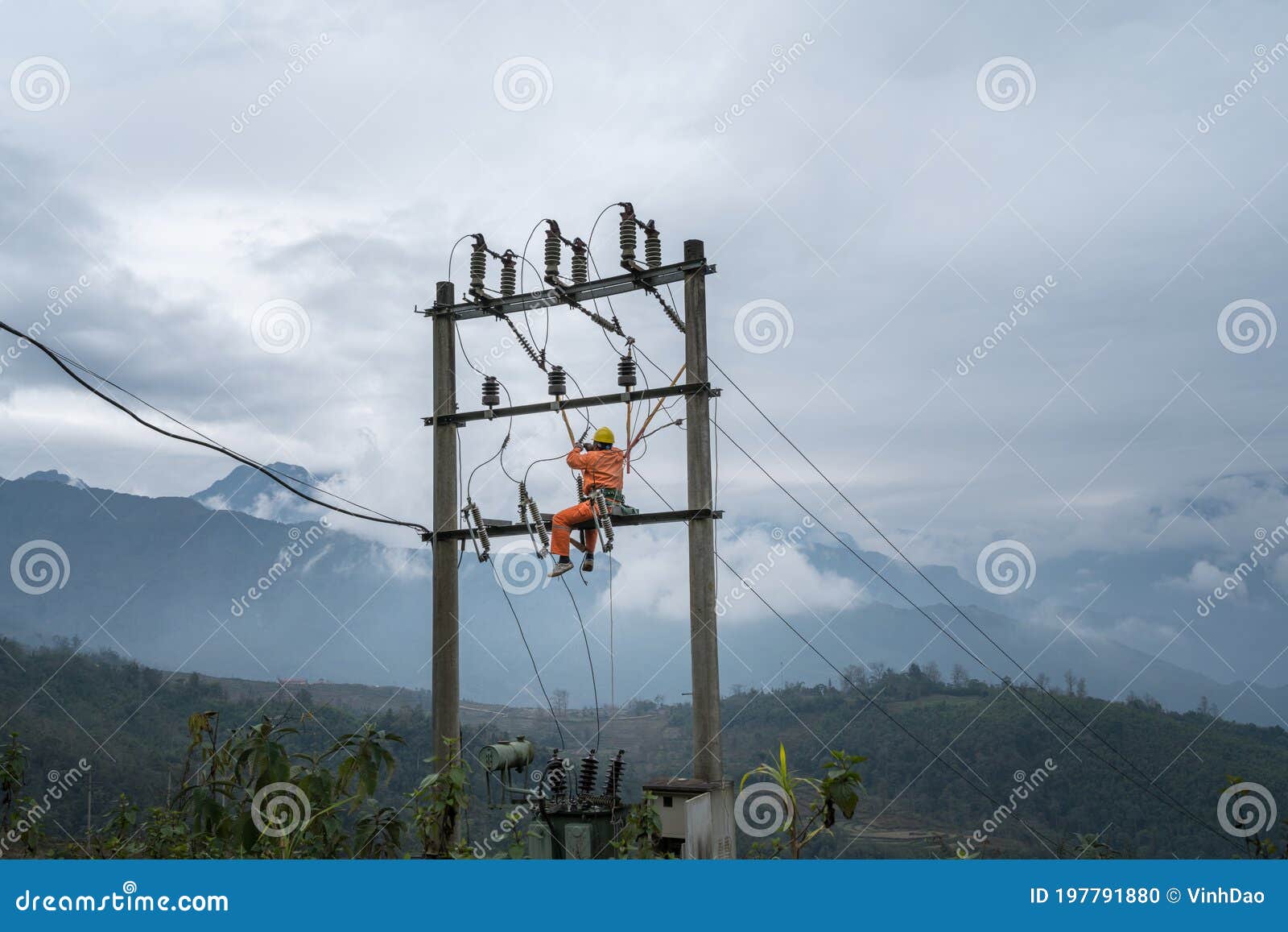 Vietnamese Electricity Worker Climb High On Electric Post To Repair