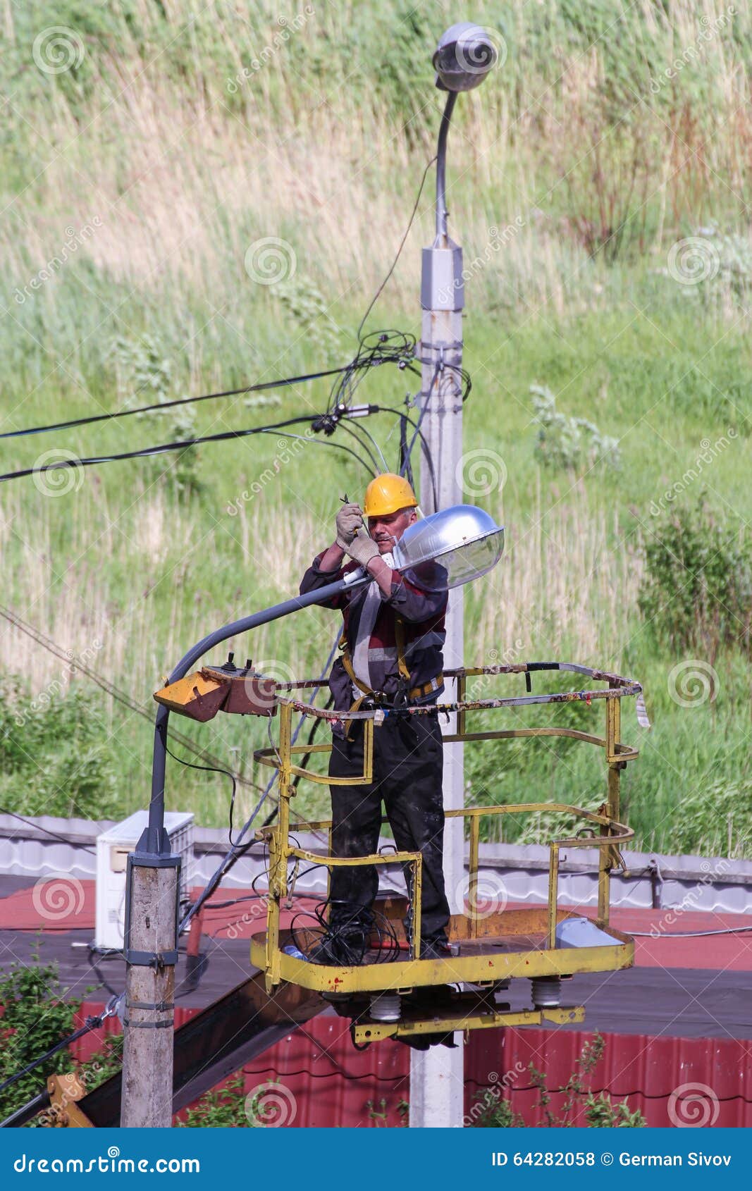 Electricians Working with Street Lighting Lanterns. Editorial Stock