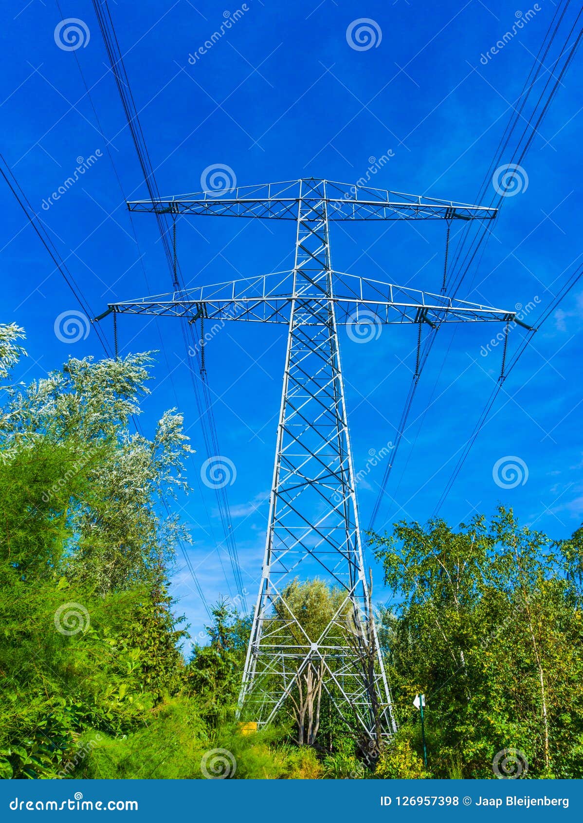 Electricity Transmission Tower with Power Cables Sky Line View Stock
