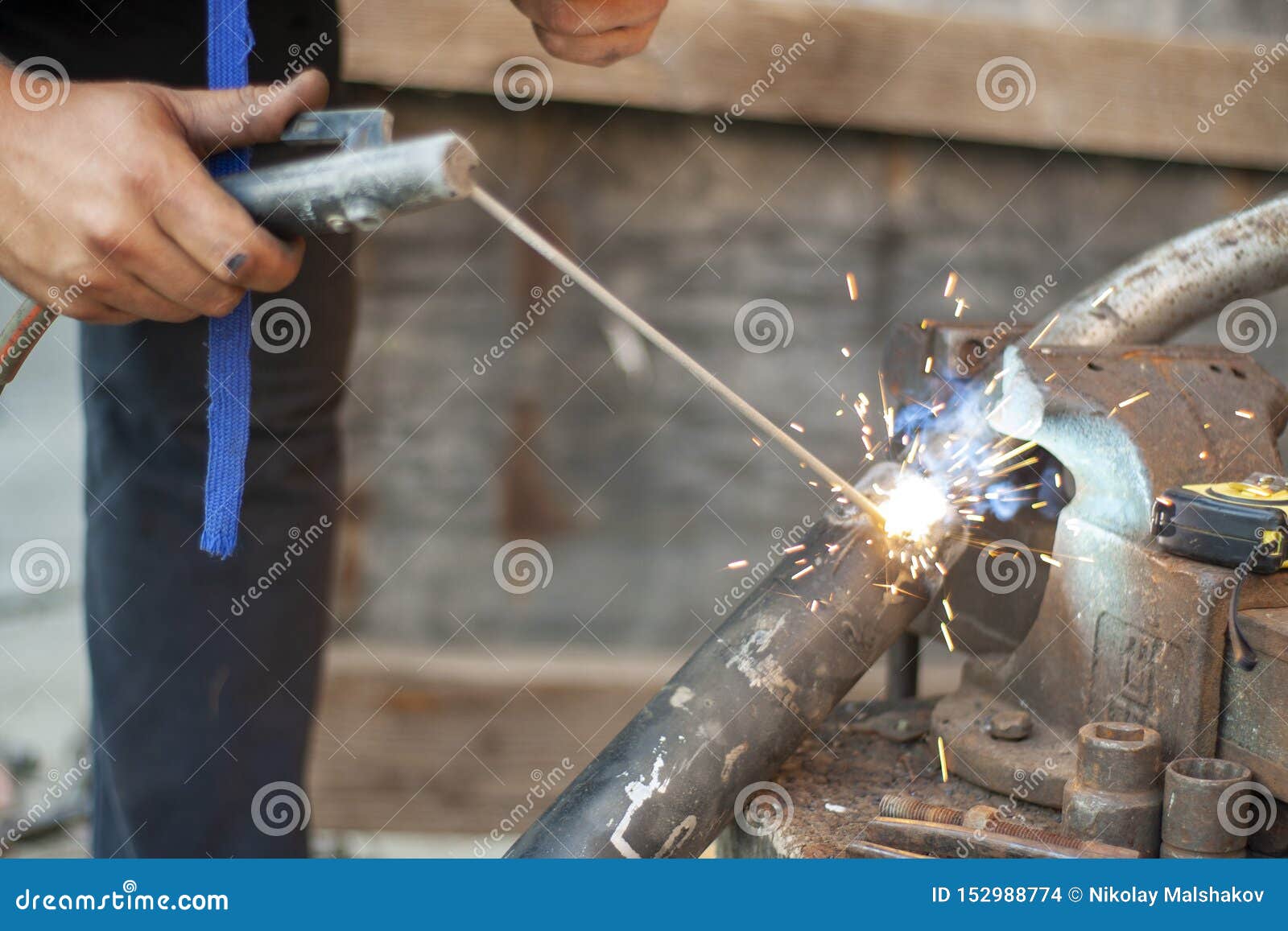 Electric Welding of Metal. Exhaust Pipe, Work with Metal Objects. Stock
