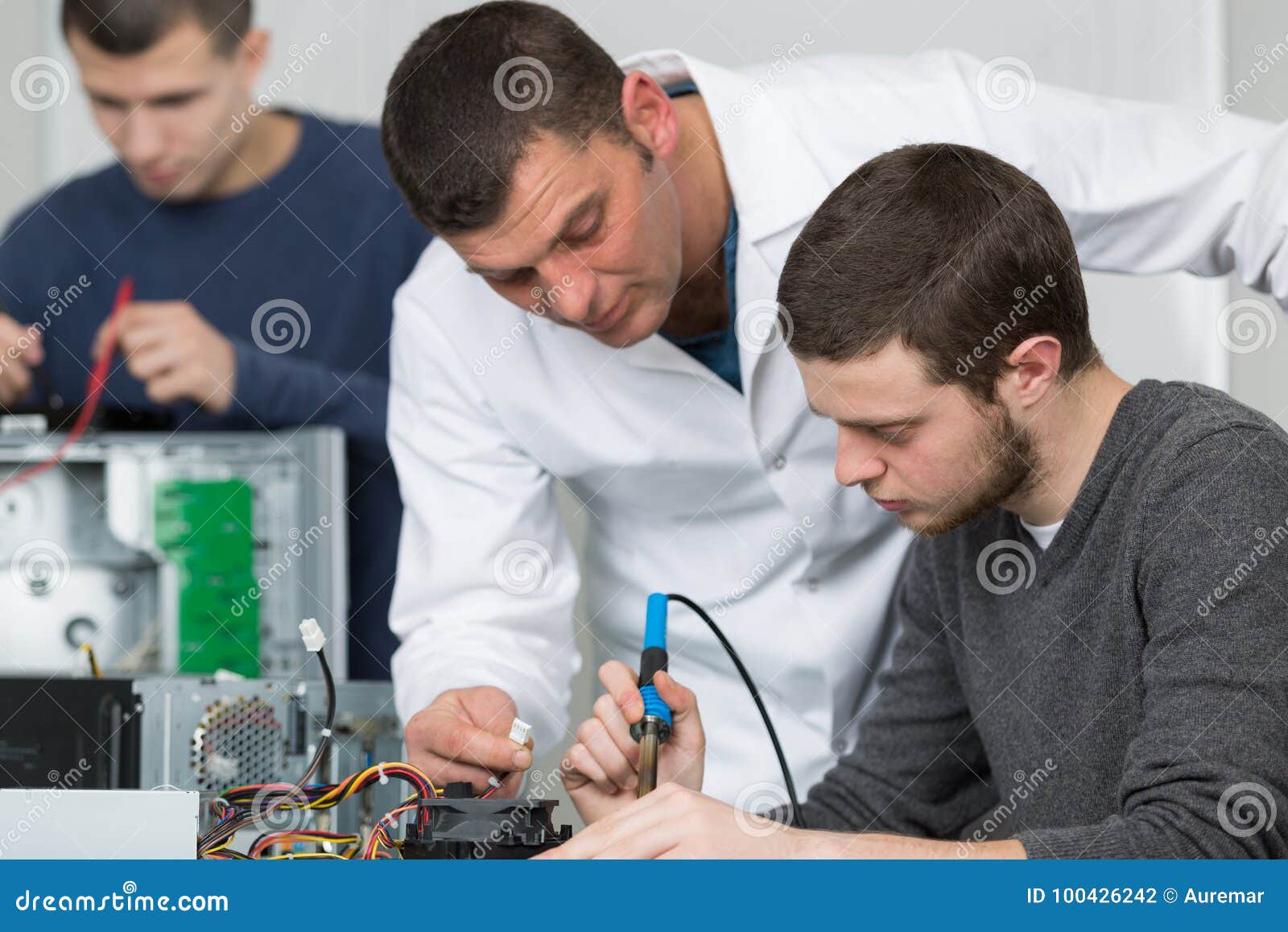 Electronic Assembler Using Soldering Iron Stock Photo Image of