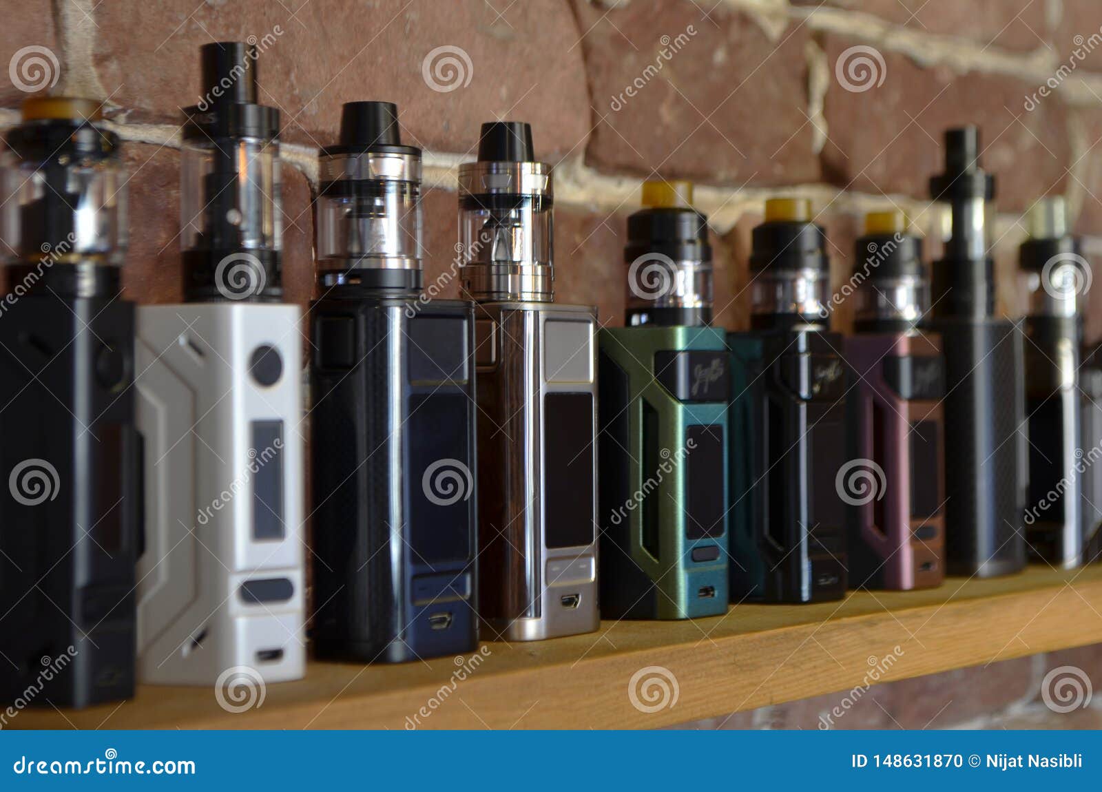 Electronic Cigarette on a Background of Vape Shop. Stock Photo Image