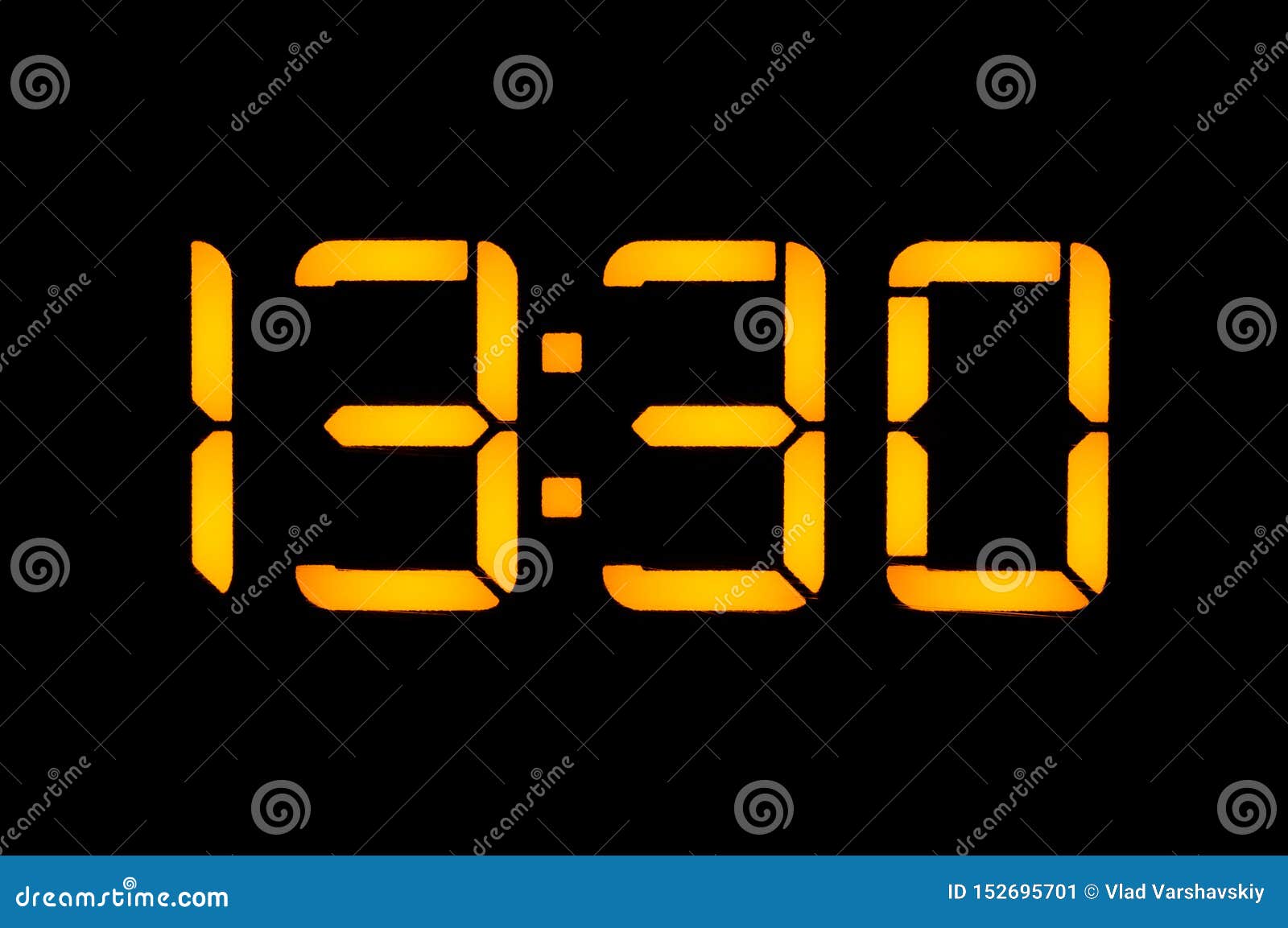 Electronic Digital Clock with Yellow Numbers on a Black Background