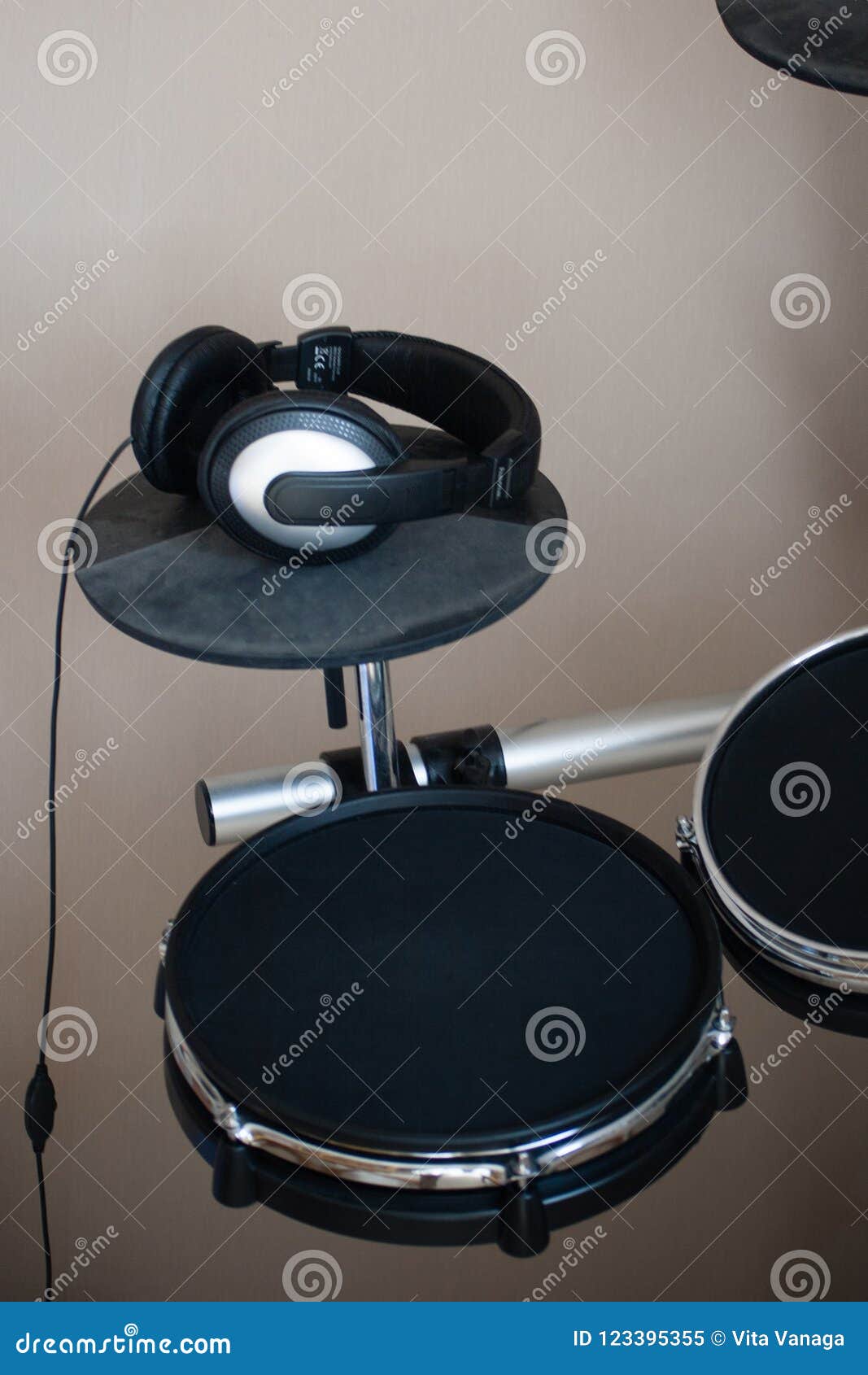 Electronic Drum Set Closeup Side View with Headphones on Drum Plate