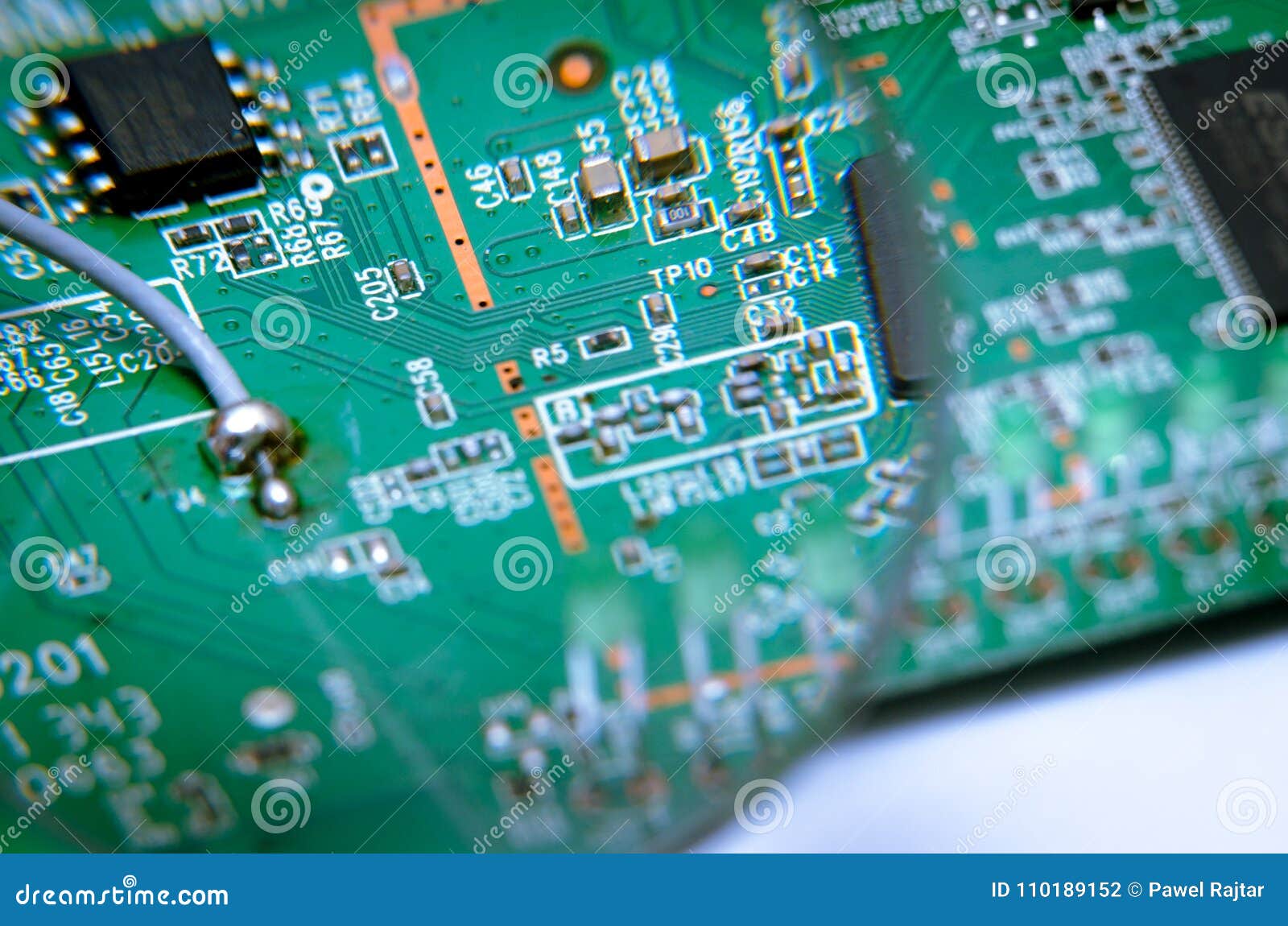 Electronic Printed Circuit Board with Soldered Cable. View through a