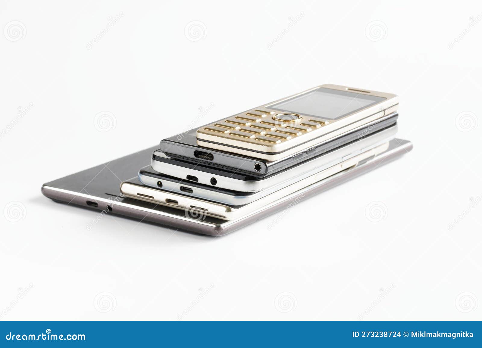 Electronic Tablet and Many Smartphones of Different Generations on a