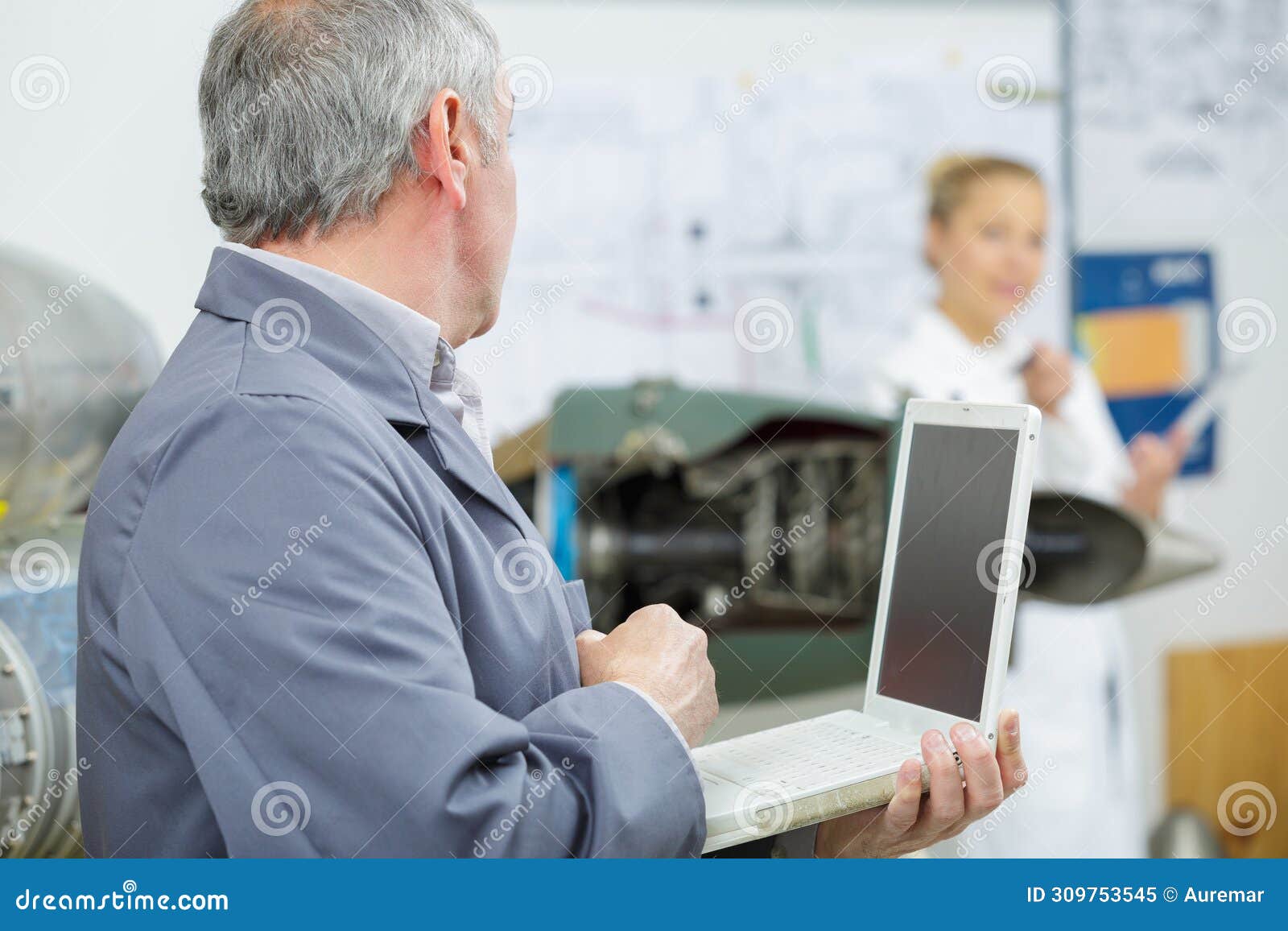 Electronic Technician Man at Repair Shop with Laptop Stock Image