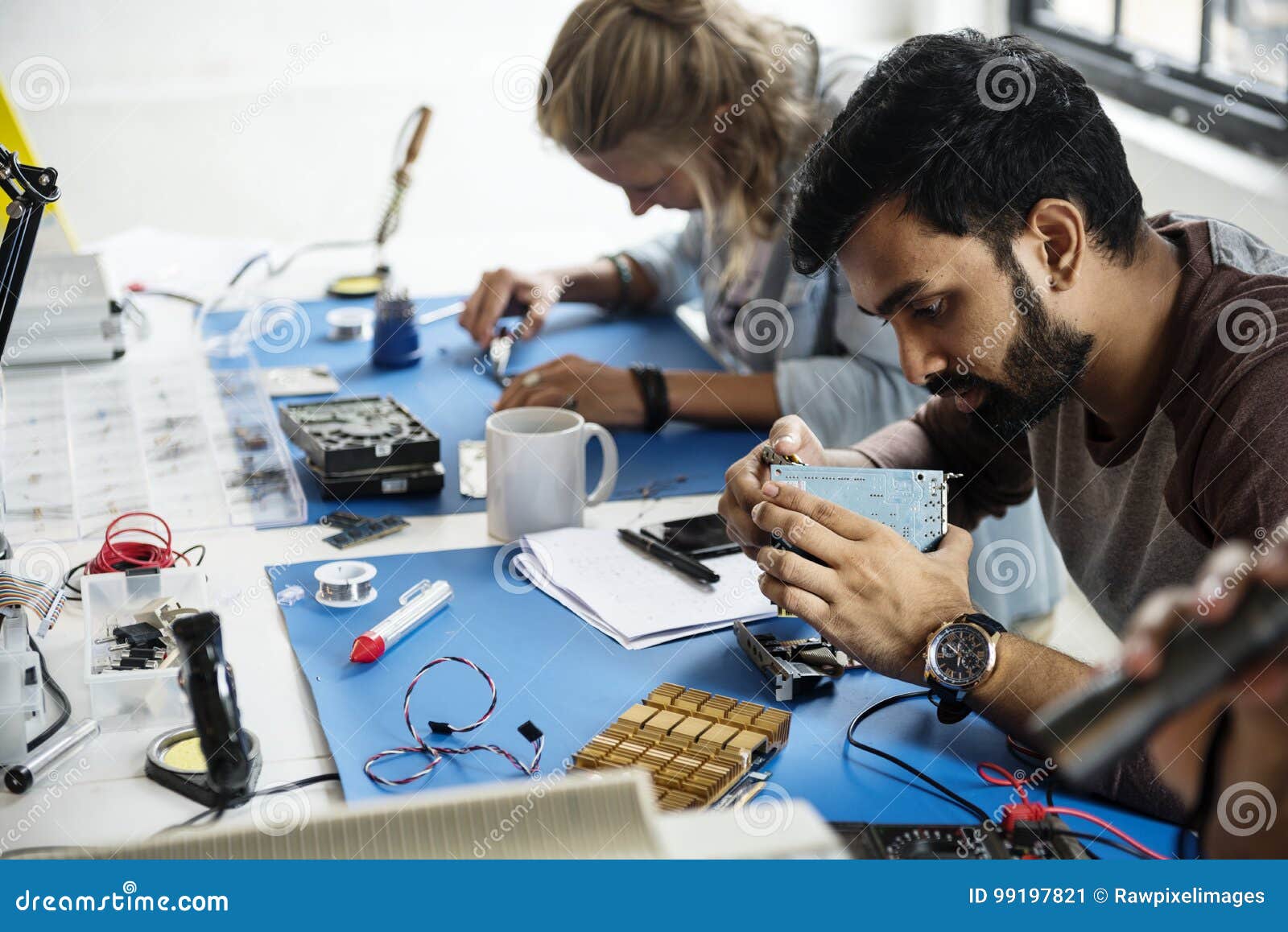 electronics technicians team working on computer parts