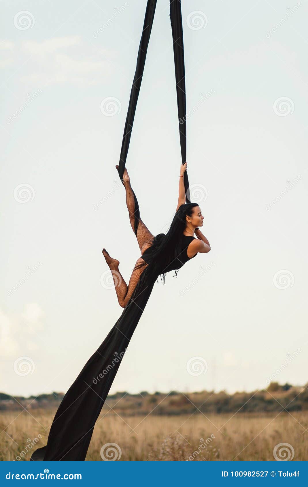 Elegance Young Beautiful Woman Dance with Aerial Silk on a Sky Background.  Fly Yoga Sport Stock Image - Image of aerialist, figure: 100982527
