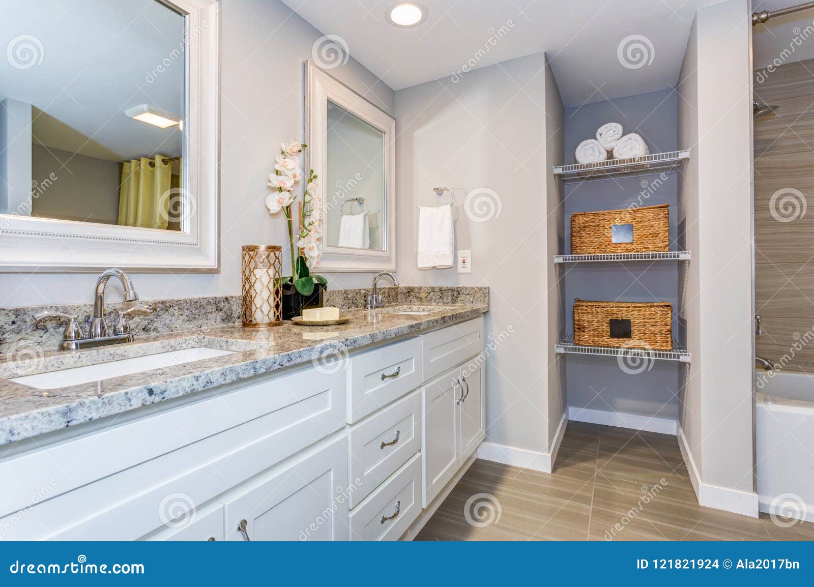 elegant bathroom with long white vanity cabinet