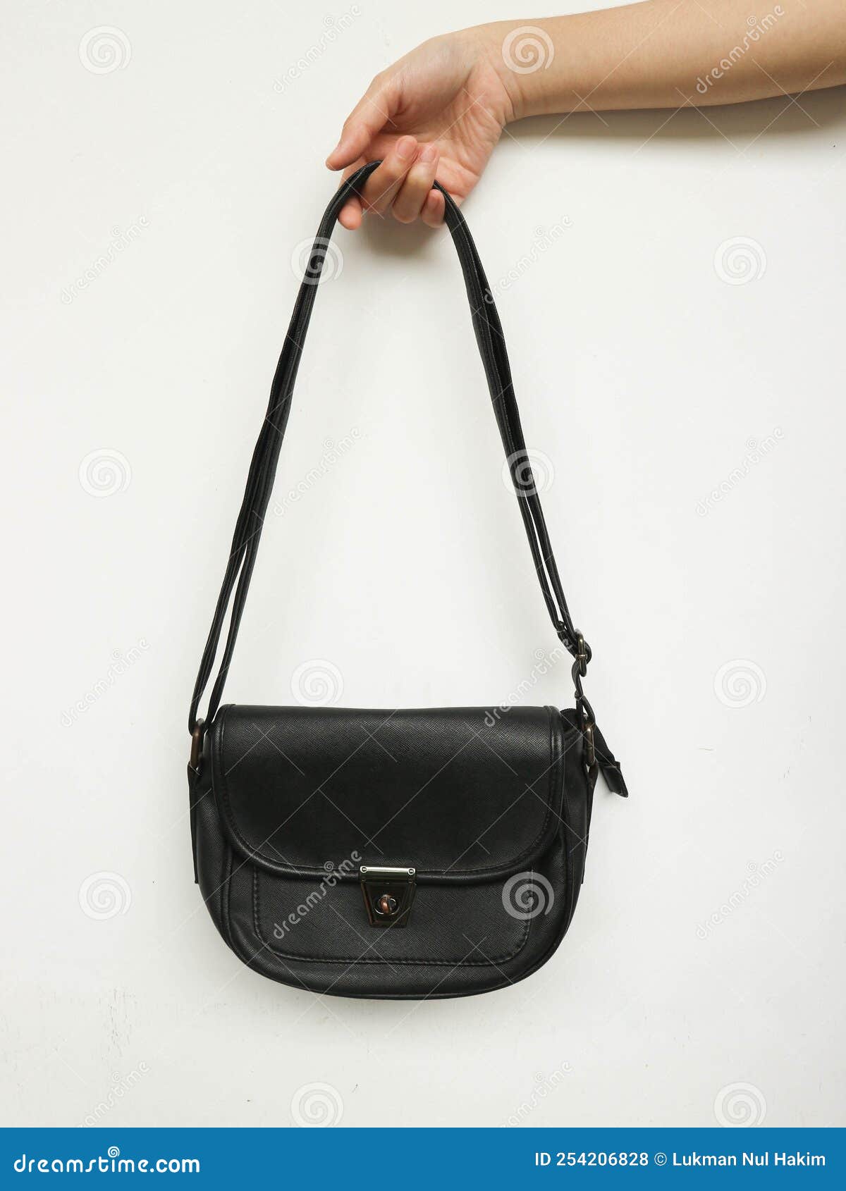 Elegant and Beautiful Black Leather Handbag Holding by Hand Stock Photo ...