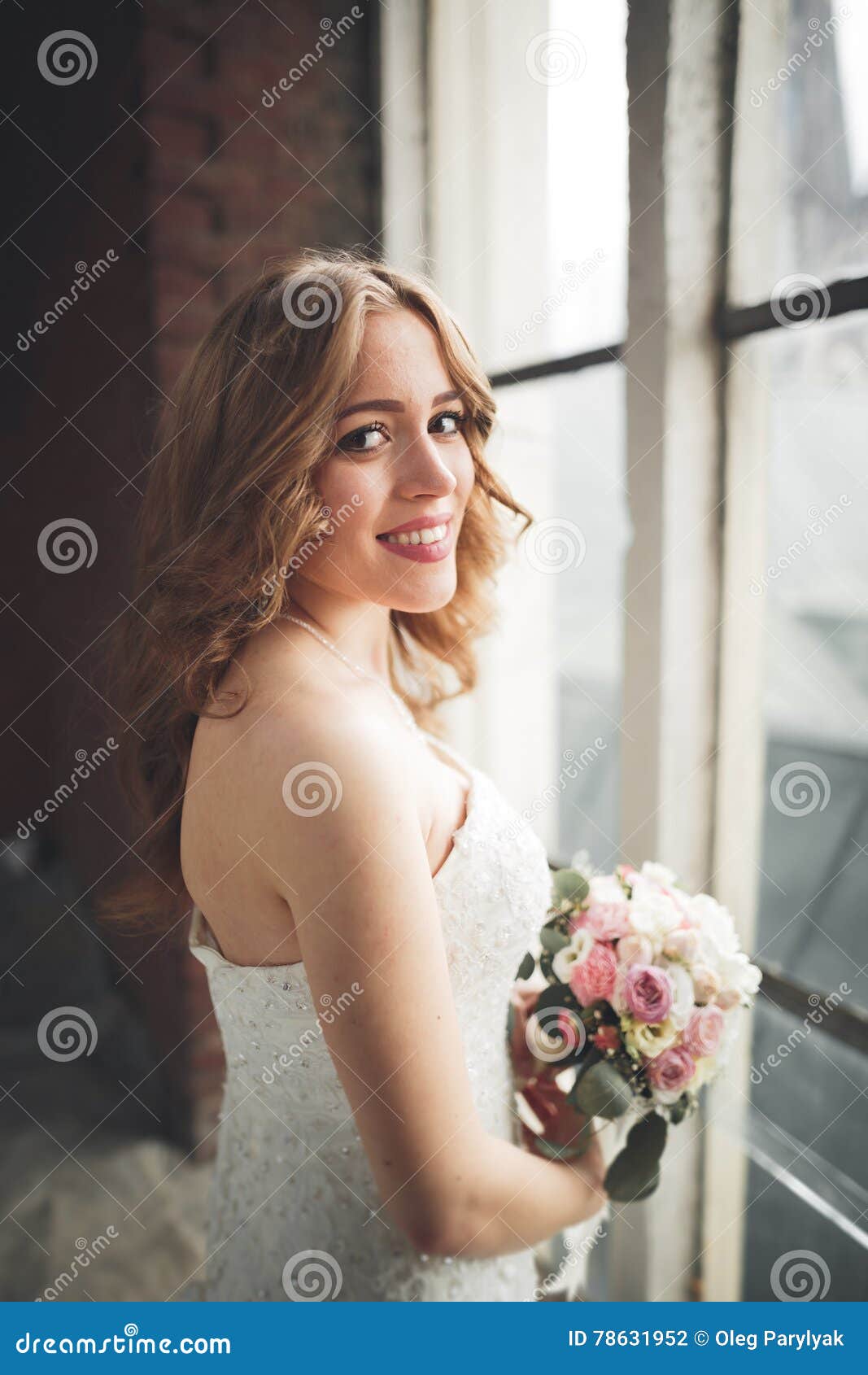 Elegant Beautiful Wedding Bride Posing Near Great Window Arch Stock