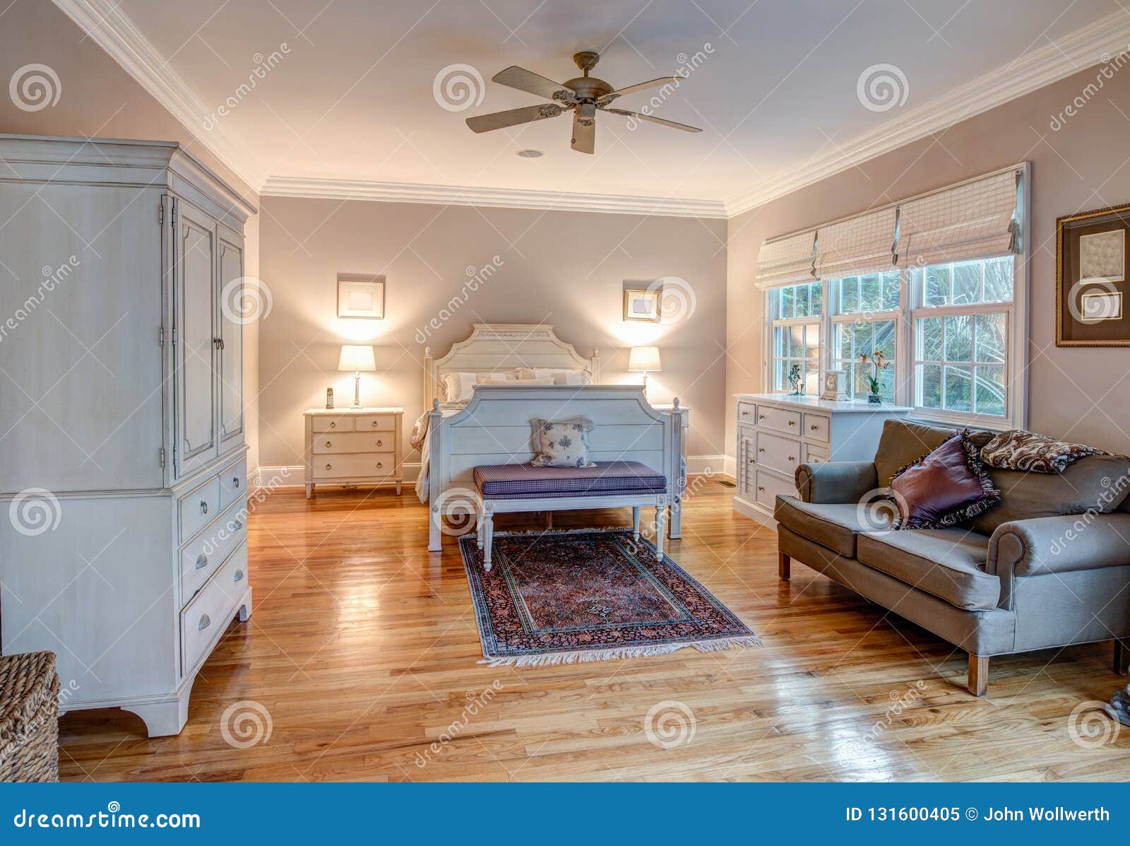 elegant bedroom with wood floors and tasteful furniture