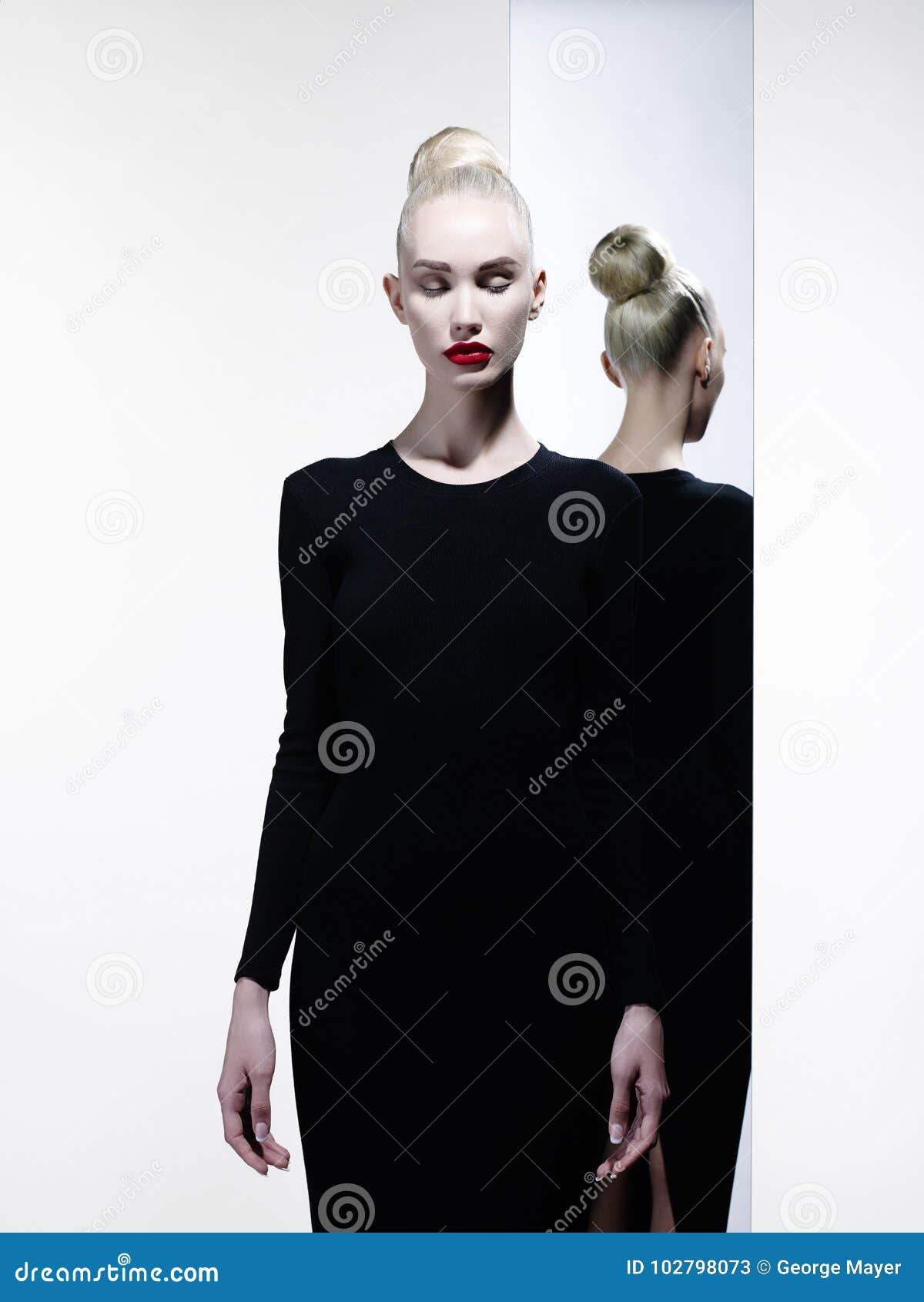 Elegant Blonde and Her Reflection in the Mirror Stock Image - Image of ...