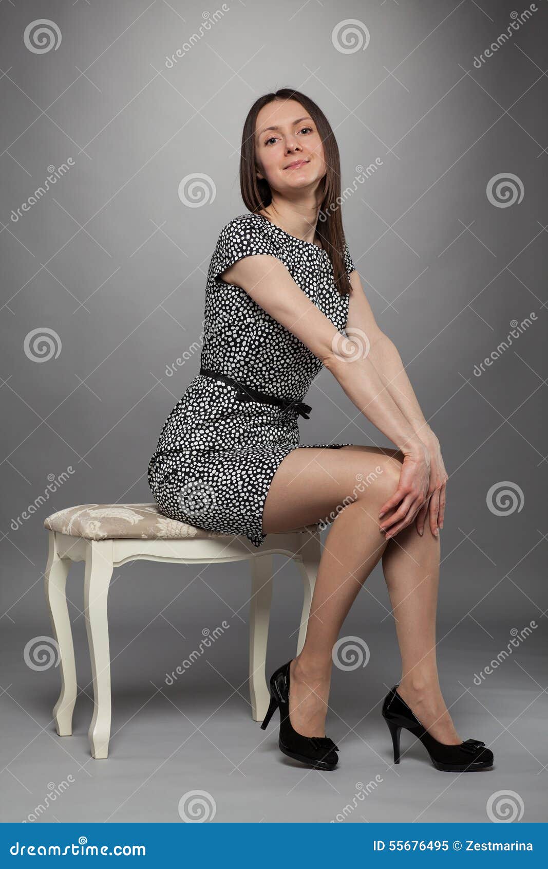 Elegant Brunette Girl in Dress Sitting on a Chair Stock Image - Image ...