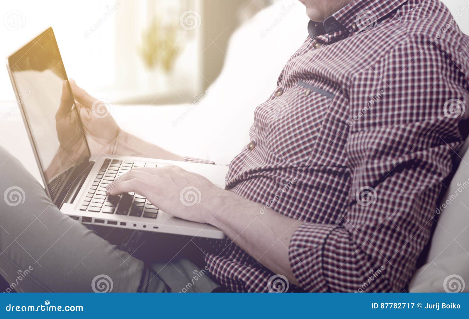 Elegant Business Multitasking Multimedia Man Using Devices at Home
